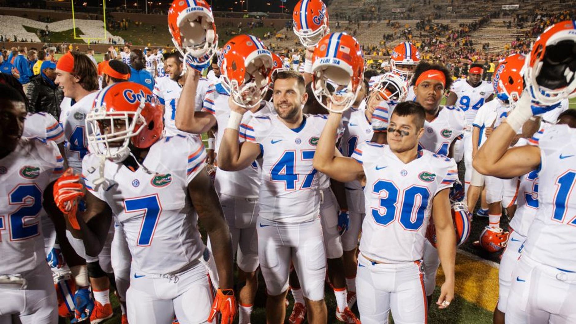 Florida teammates celebrate with their fans after they beat Missouri 21-3 in an NCAA college football game, Saturday, Oct. 10 2015, in Columbia, Mo. (AP Photo/L.G. Patterson)