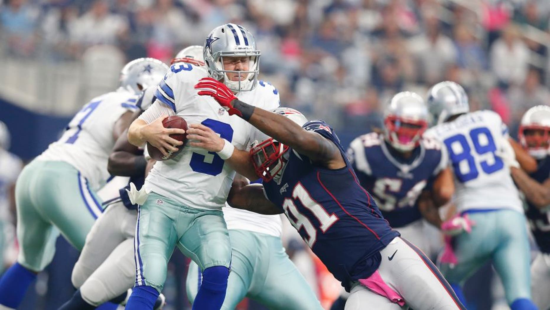 Oct 11, 2015; Arlington, TX, USA; Dallas Cowboys quarterback Brandon Weeden (3) is sacked by New England Patriots linebacker Jamie Collins (91) at AT&T Stadium. Mandatory Credit: Matthew Emmons-USA TODAY Sports