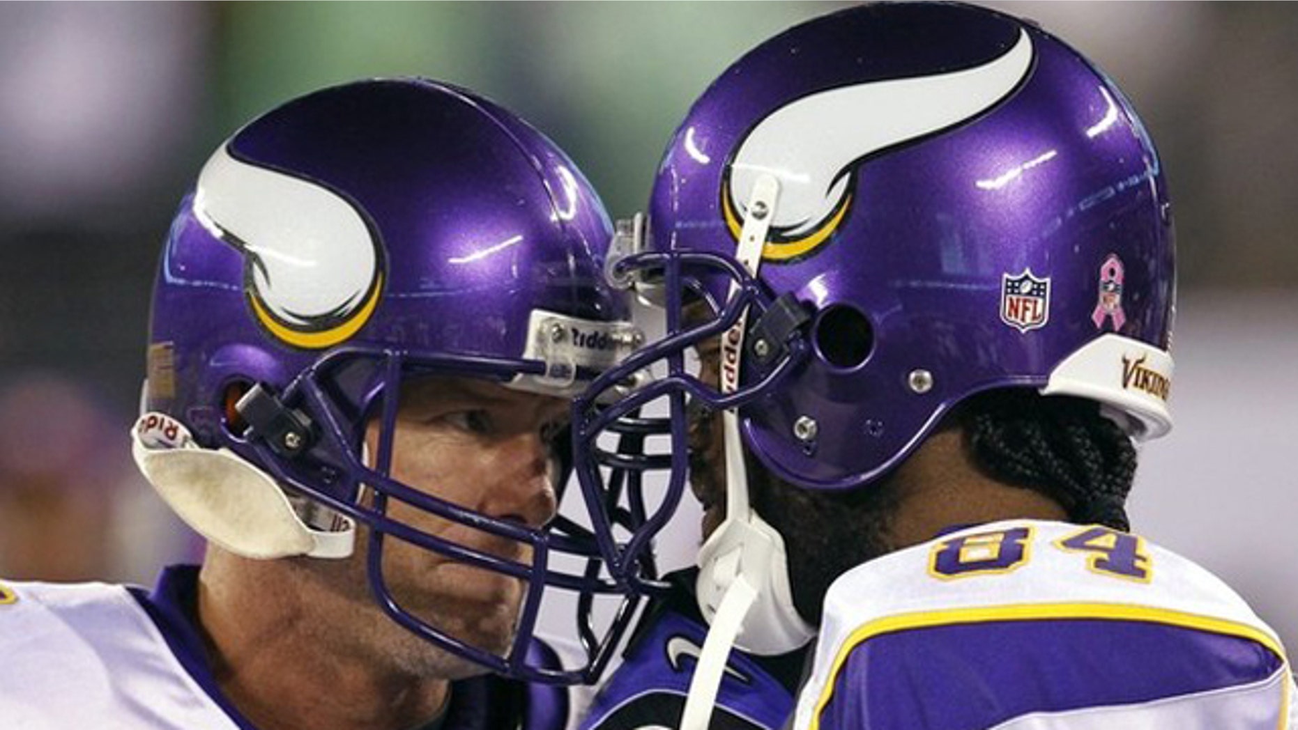 Oct. 11: Minnesota Viking wide receiver Randy Moss (R) and quarterback Brett Favre butt heads together on the bench before their NFL football game against the New York Jets in East Rutherford, New Jersey.