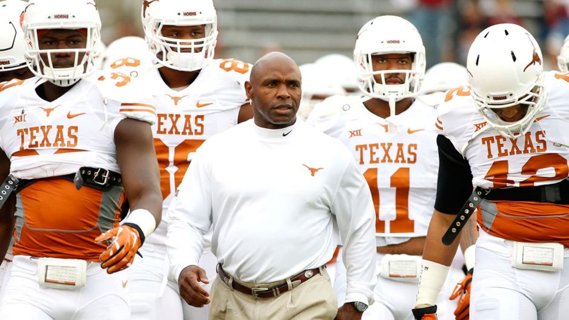 Oct 11, 2014; Dallas, TX, USA; Texas Longhorns head coach Charlie Strong takes the field with his team before the game against the Oklahoma Sooners at the Cotton Bowl. Mandatory Credit: Tim Heitman-USA TODAY Sports