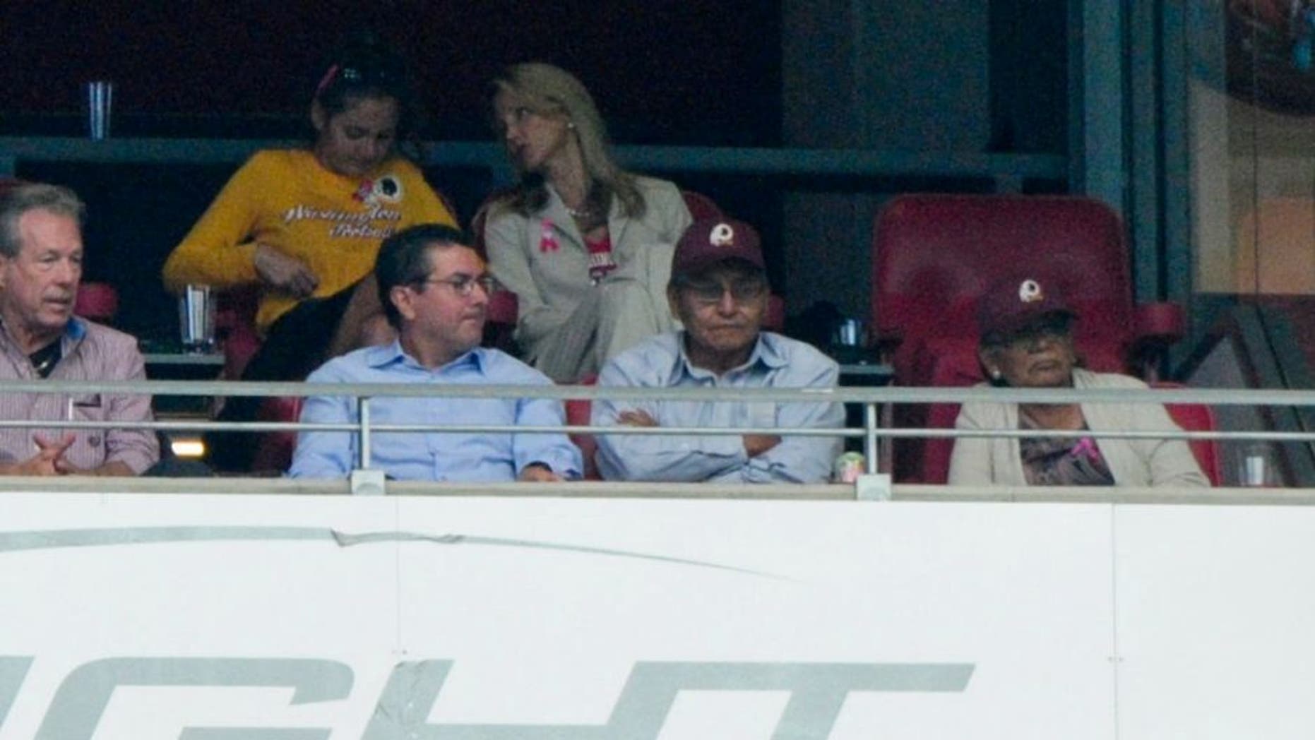Oct 12, 2014; Glendale, AZ, USA; Washington Redskins owner Dan Snyder (left) talks with Navajo Nation president Ben Shelly (right) during the first half against the Arizona Cardinals at University of Phoenix Stadium. Mandatory Credit: Matt Kartozian-USA TODAY Sports