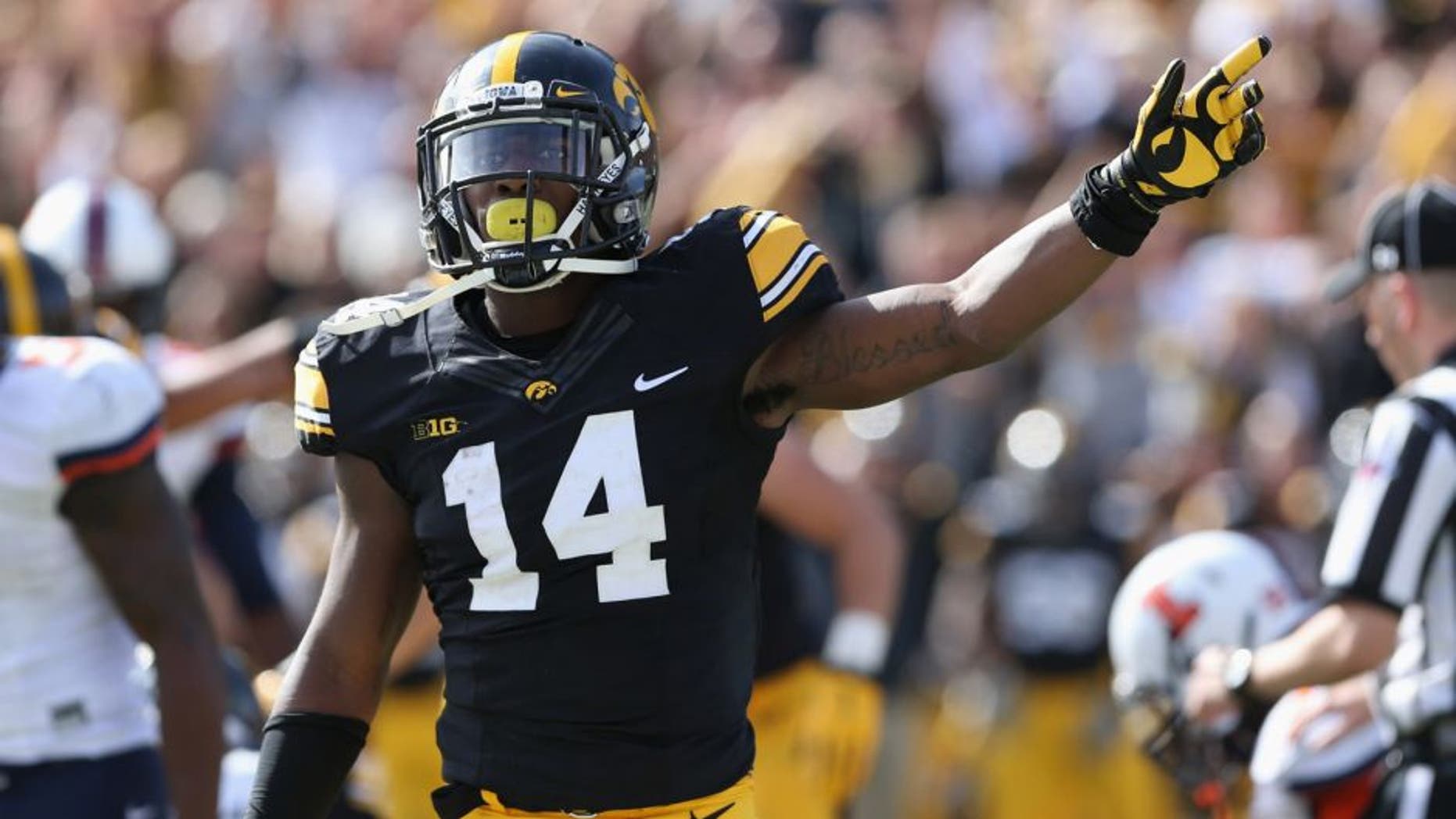 Oct 10, 2015; Iowa City, IA, USA; Iowa Hawkeyes defensive back Desmond King (14) signals for the first down late in the fourth quarter after Iowa recovered a fumble against the Illinois Fighting Illini at Kinnick Stadium. Iowa beat Illinois 29-20. Mandatory Credit: Reese Strickland-USA TODAY Sports