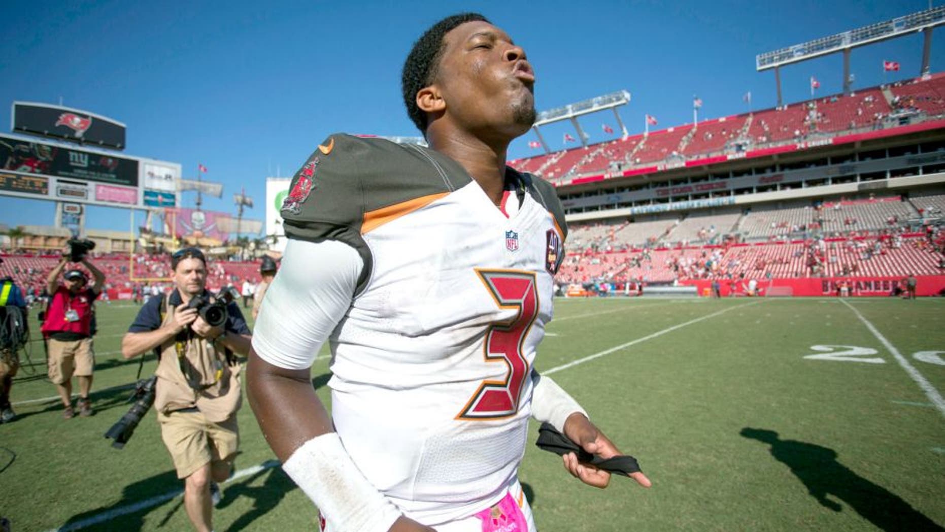 Oct 11, 2015; Tampa, FL, USA; Tampa Bay Buccaneers quarterback Jameis Winston (3) runs off the field at the end of the game against the Jacksonville Jaguars at Raymond James Stadium. The Tampa Bay Buccaneers won 38-31. Mandatory Credit: Logan Bowles-USA TODAY Sports