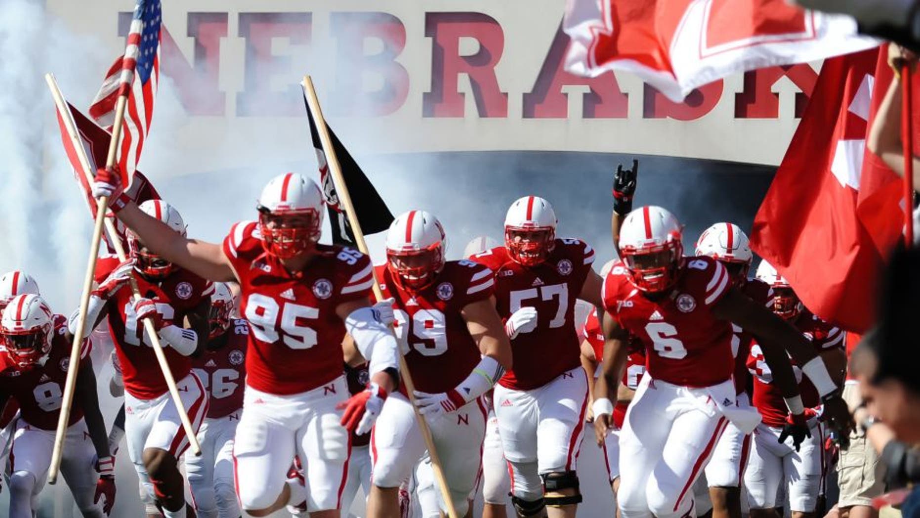 Oct 10, 2015; Lincoln, NE, USA; Nebraska Cornhuskers defensive end Jack Gangwish (95) leads the team on the field against the Wisconsin Badgers at Memorial Stadium. Mandatory Credit: Steven Branscombe-USA TODAY Sports