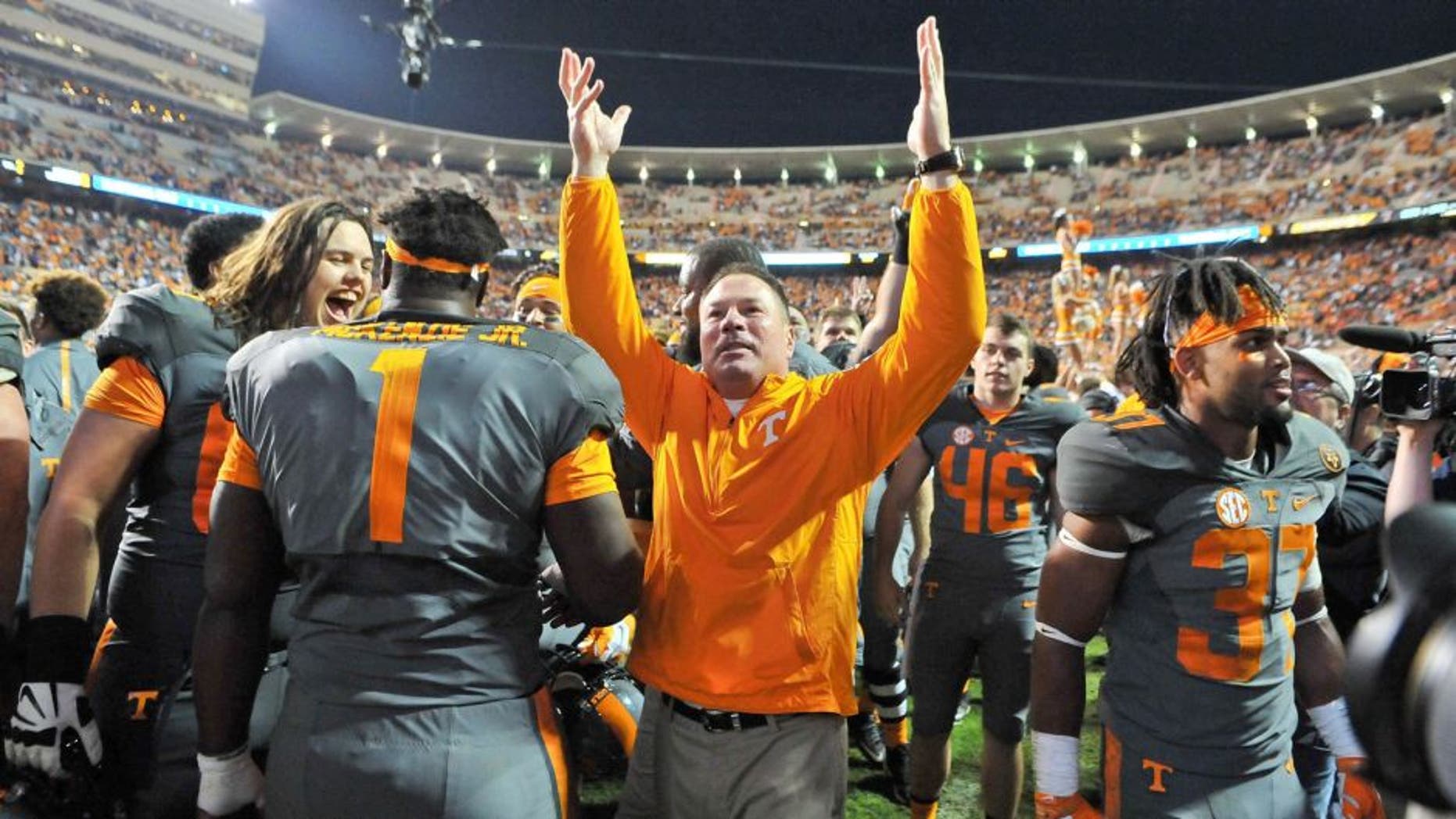 Oct 10, 2015; Knoxville, TN, USA; Tennessee Volunteers head coach Butch Jones waves to fans after his team defeated the Georgia Bulldogs during the second half at Neyland Stadium. Tennessee won 38-31. Mandatory Credit: Jim Brown-USA TODAY Sports