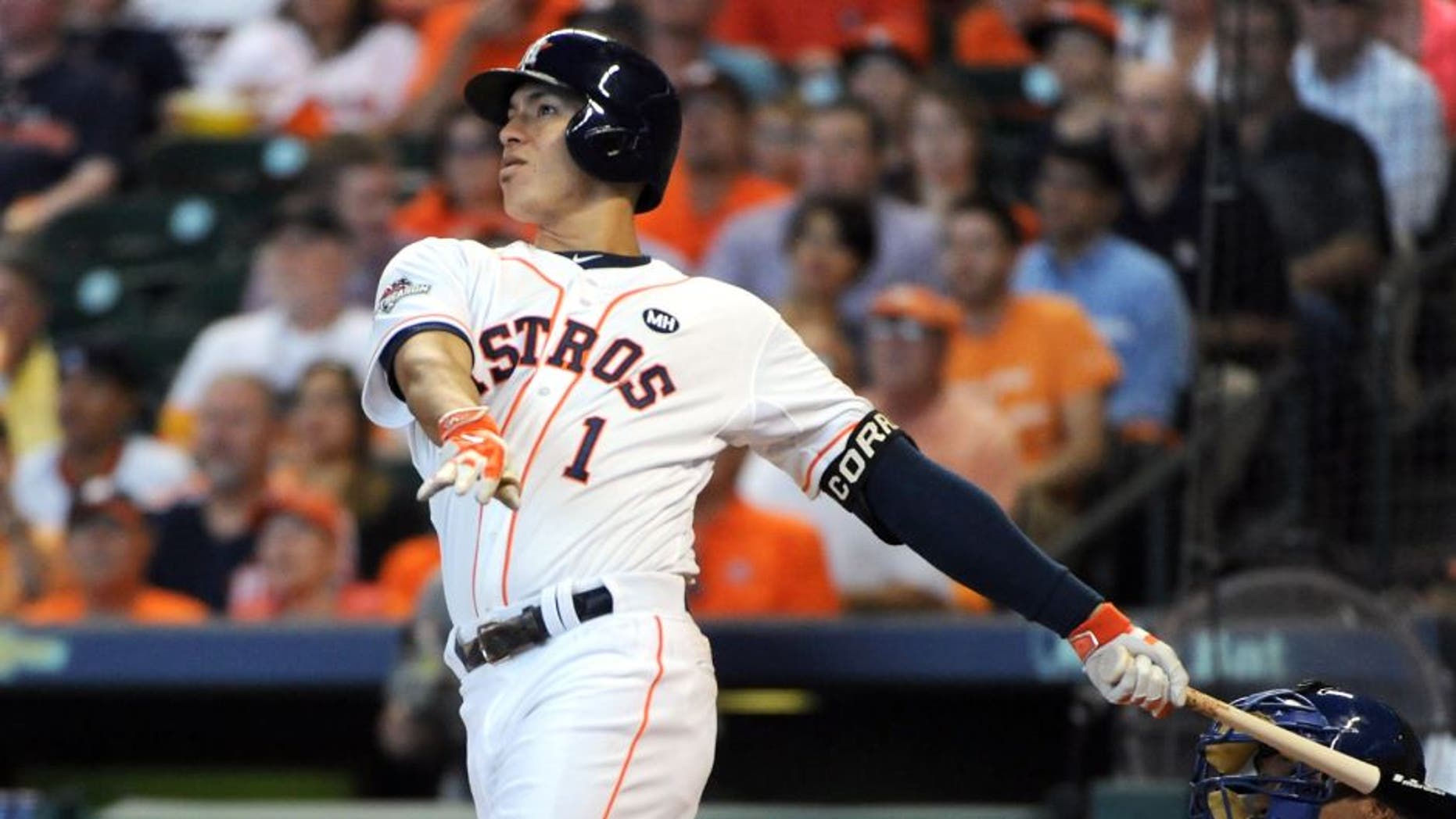 HOUSTON, TX - OCTOBER 12: Carlos Correa #1 of the Houston Astros hits a solo home run to tie the game in the third inning against the Kansas City Royals during game four of the American League Divison Series at Minute Maid Park on October 12, 2015 in Houston, Texas. (Photo by Eric Christian Smith/Getty Images)