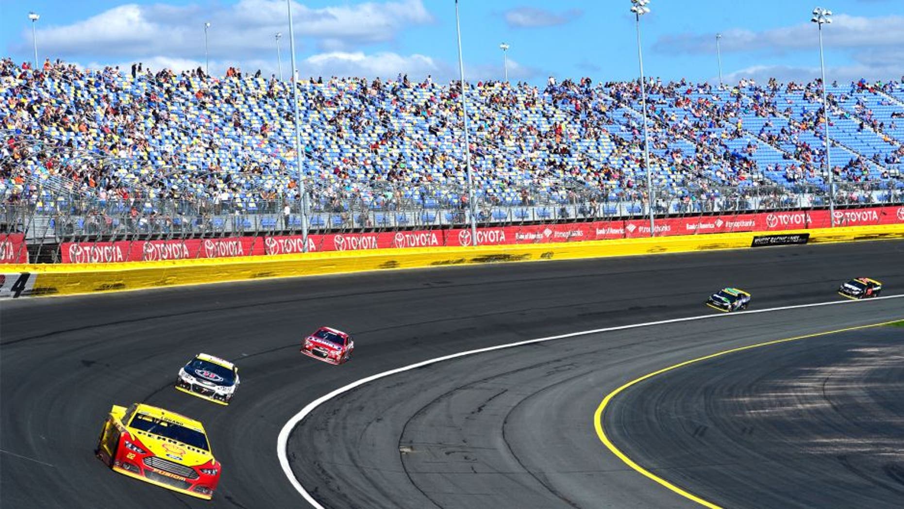 CHARLOTTE, NC - OCTOBER 11: Joey Logano, driver of the #22 Shell Pennzoil Ford, leads a pack of cars during the NASCAR Sprint Cup Series Bank of America 500 at Charlotte Motor Speedway on October 11, 2015 in Charlotte, North Carolina. (Photo by Robert Laberge/NASCAR via Getty Images)
