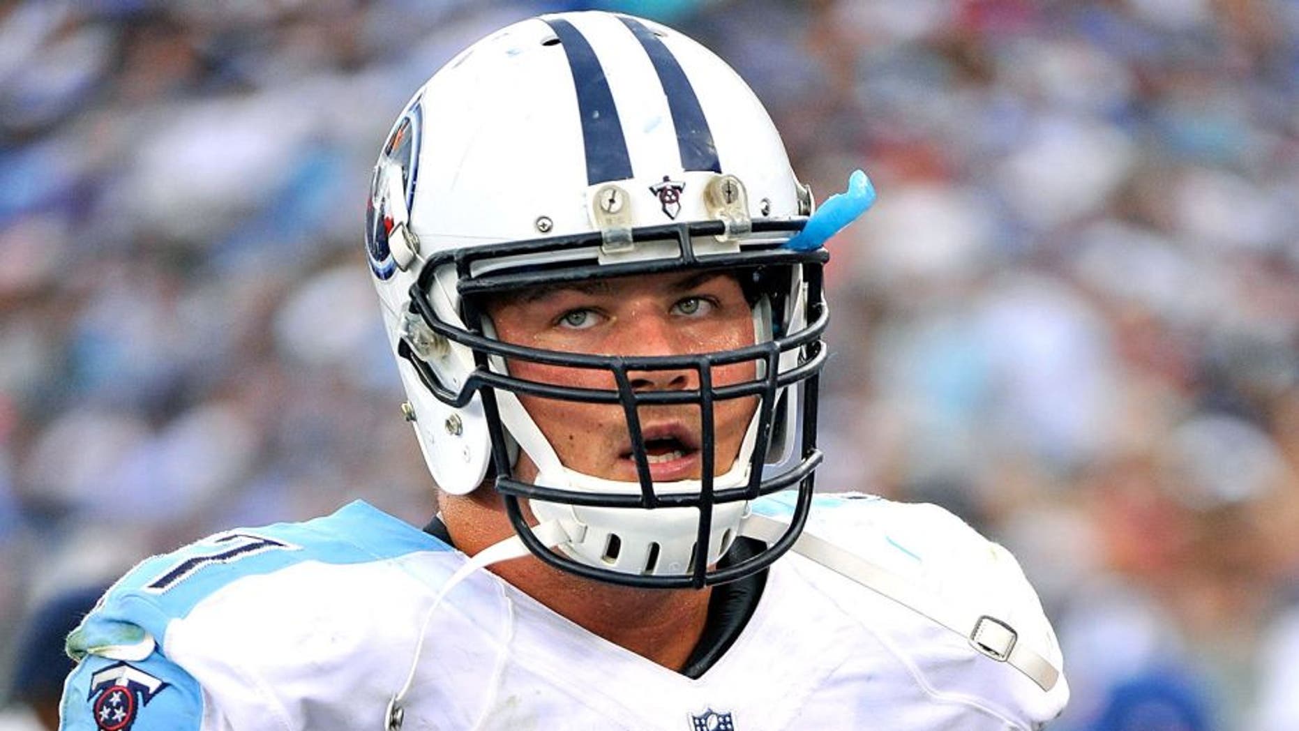 NASHVILLE, TN - SEPTEMBER 27: Taylor Lewan #77 of the Tennessee Titans watches from the sideline during a game against the Indianapolis Colts at Nissan Stadium on September 27, 2015 in Nashville, Tennessee. (Photo by Frederick Breedon/Getty Images)