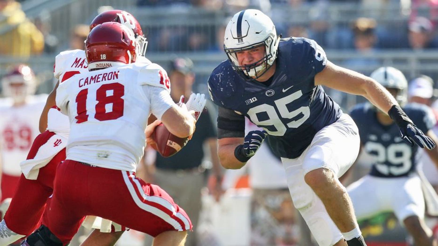 Oct 10, 2015; University Park, PA, USA; Penn State Nittany Lions defensive end Carl Nassib (95) pressures Indiana Hoosiers quarterback Danny Cameron (18) during the fourth quarter at Beaver Stadium. Penn State defeated Indiana 29-7. Mandatory Credit: Matthew O'Haren-USA TODAY Sports