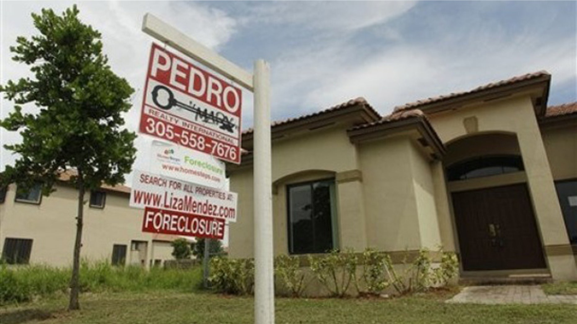 Sept. 14: A foreclosed home sits empty in a Homestead, Fla., neighborhood where half of the houses are empty and up for foreclosure.