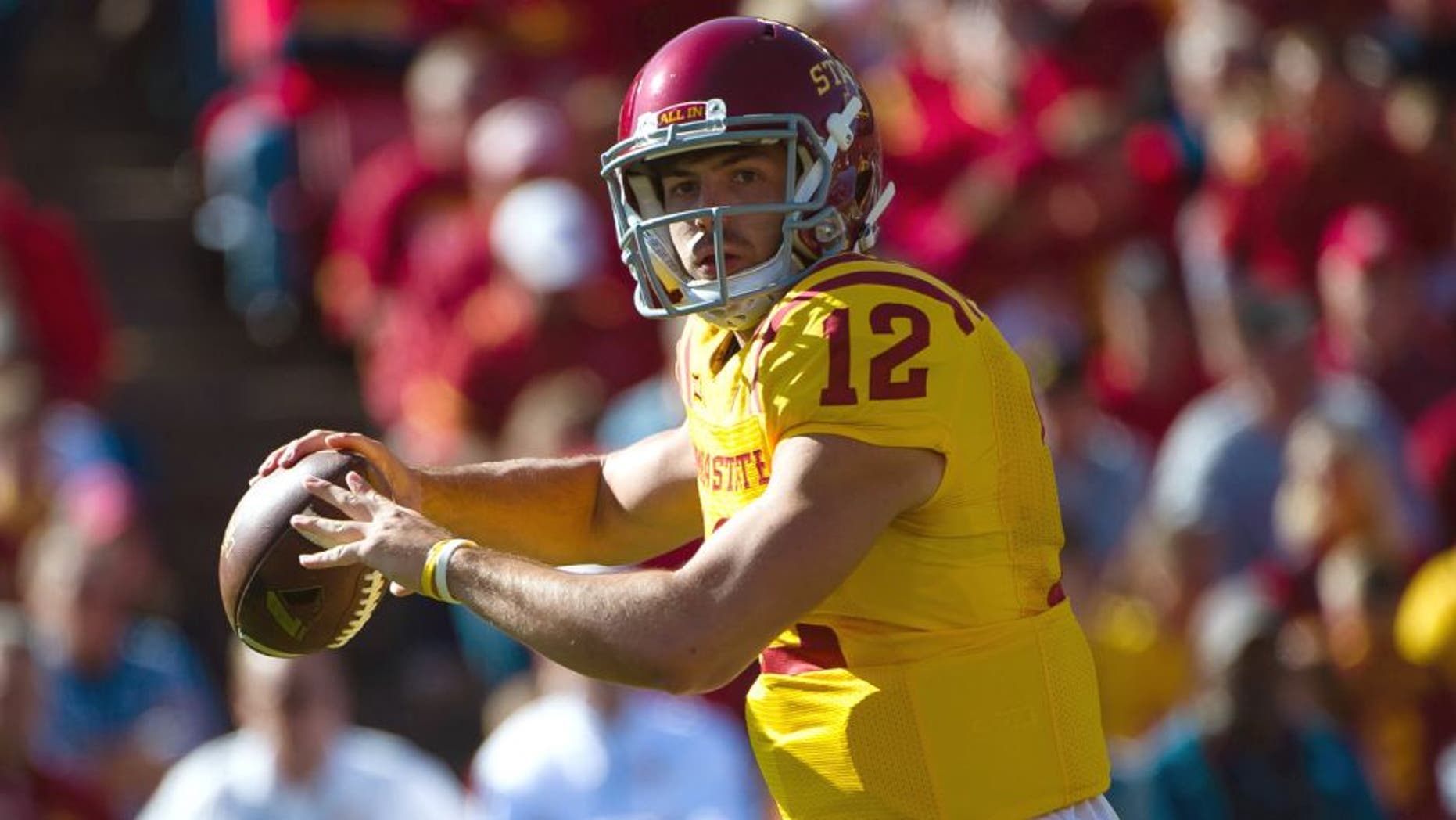 Oct 11, 2014; Ames, IA, USA; Iowa State Cyclones quarterback Sam B. Richardson (12) passes against the Toledo Rockets at Jack Trice Stadium. Mandatory Credit: Steven Branscombe-USA TODAY Sports