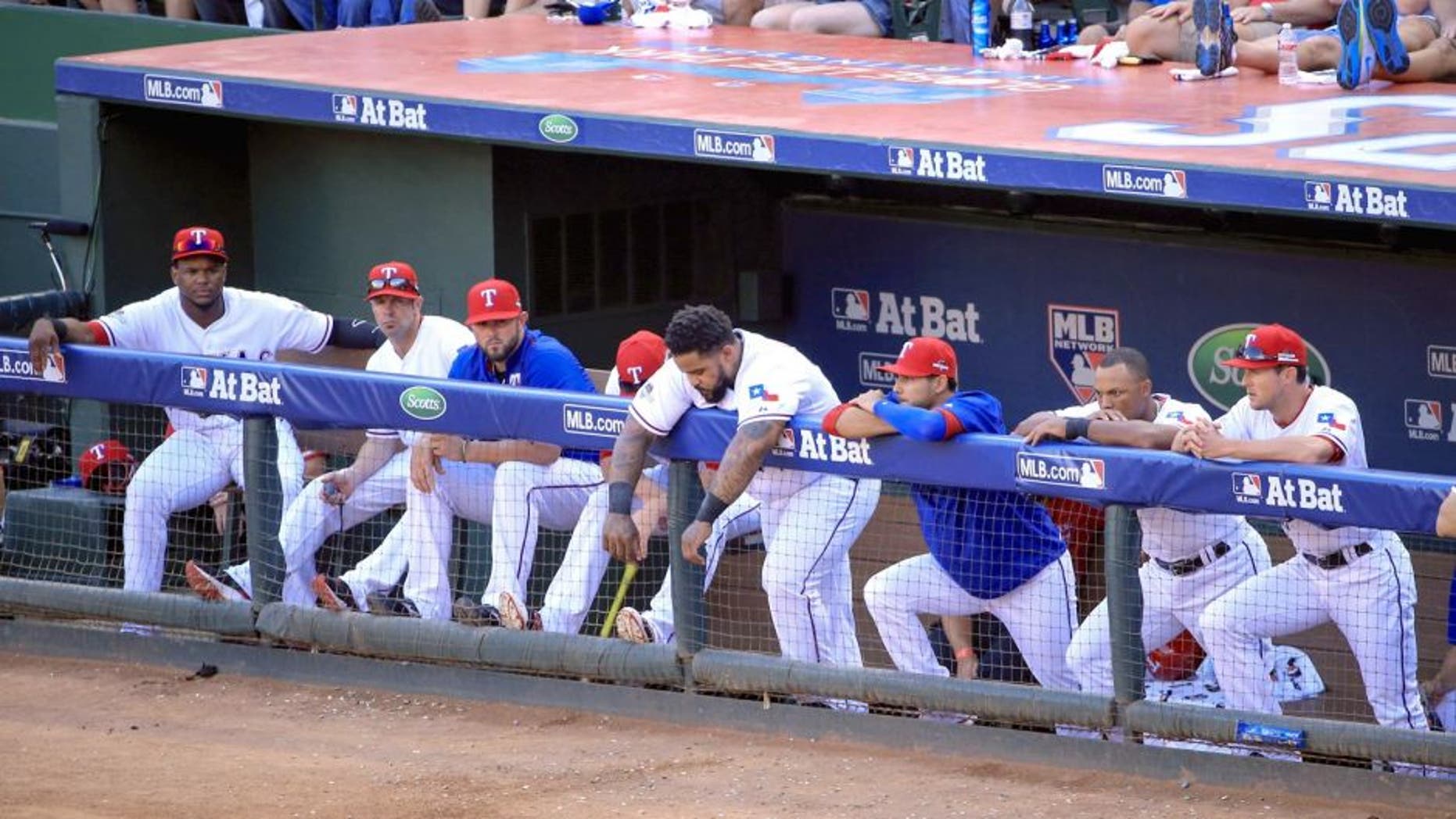 Oct 12, 2015; Arlington, TX, USA; Texas Rangers designated hitter Prince Fielder (middle) reacts with teammates during the game against the Toronto Blue Jays in game four of the ALDS at Globe Life Park in Arlington. Mandatory Credit: Kevin Jairaj-USA TODAY Sports
