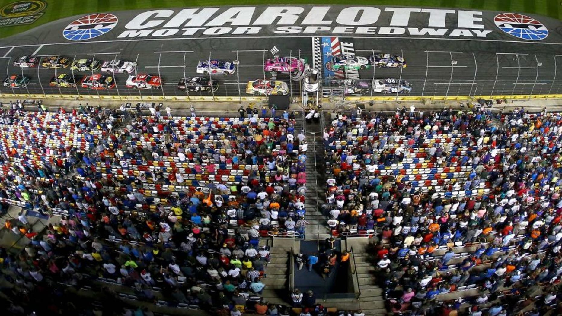 CHARLOTTE, NC - OCTOBER 10: A general view of cars racing during the NASCAR Nationwide Series Drive For The Cure 300 presented by Blue Cross Blue Shield of North Carolina at Charlotte Motor Speedway on October 10, 2014 in Charlotte, North Carolina. (Photo by Streeter Lecka/Getty Images)