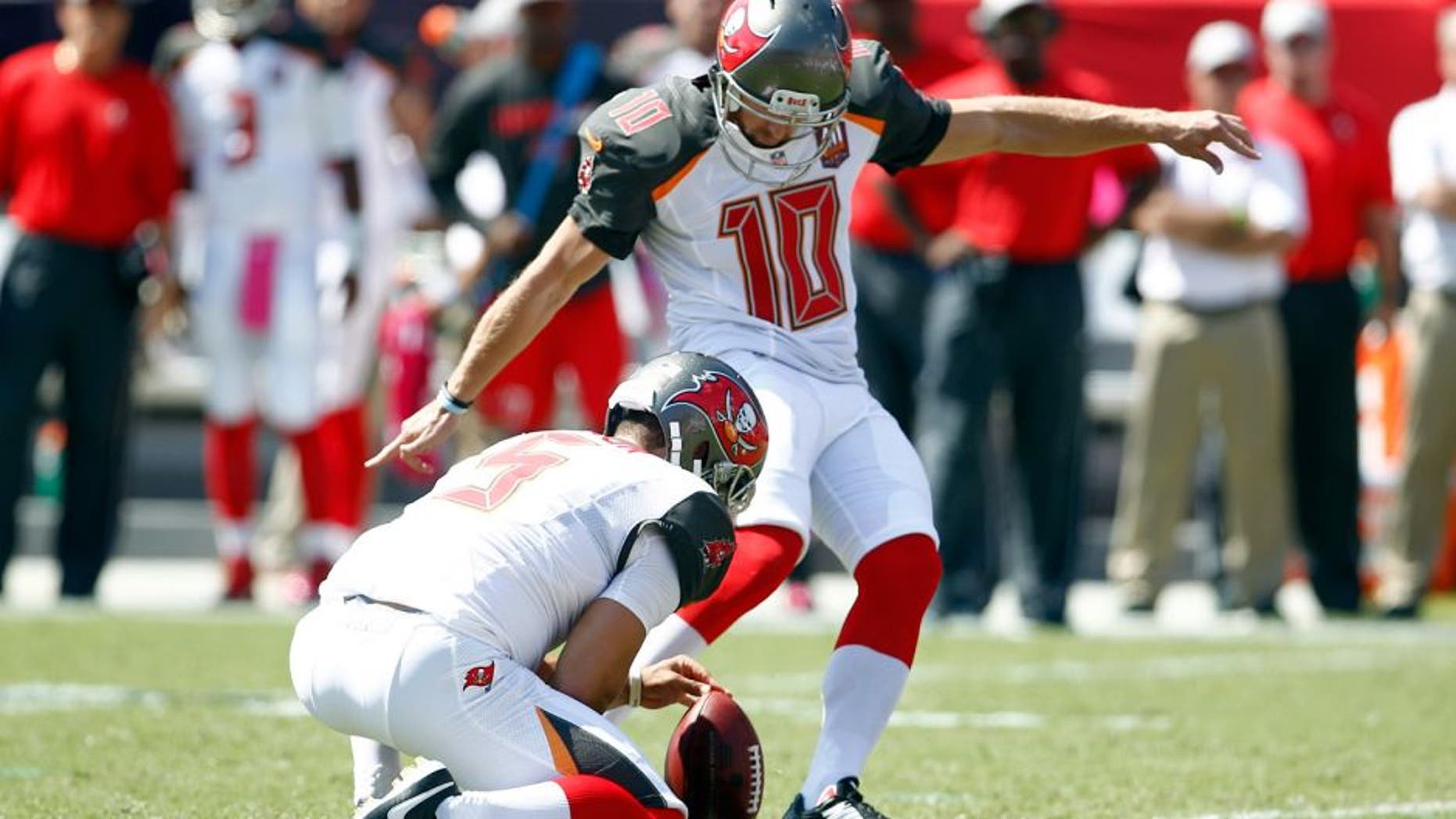 Oct 11, 2015; Tampa, FL, USA; Tampa Bay Buccaneers place kicker Connor Barth kicks his first field goal from the hold of punter Jacob Schum (5) after being re-signed by the Tampa Bay Buccaneers against the Jacksonville Jaguars during the first quarter of an NFL football game at Raymond James Stadium. Mandatory Credit: Reinhold Matay-USA TODAY Sports