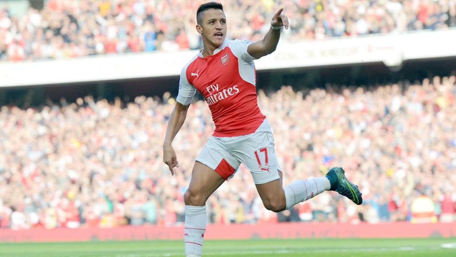 LONDON, ENGLAND - OCTOBER 04: Alexis Sanchez celebrates scoring the 1st Arsenal goal during the Barclays Premier League match between Arsenal and Manchester United at Emirates Stadium on October 4, 2015 in London, England. (Photo by Stuart MacFarlane/Arsenal FC via Getty Images)