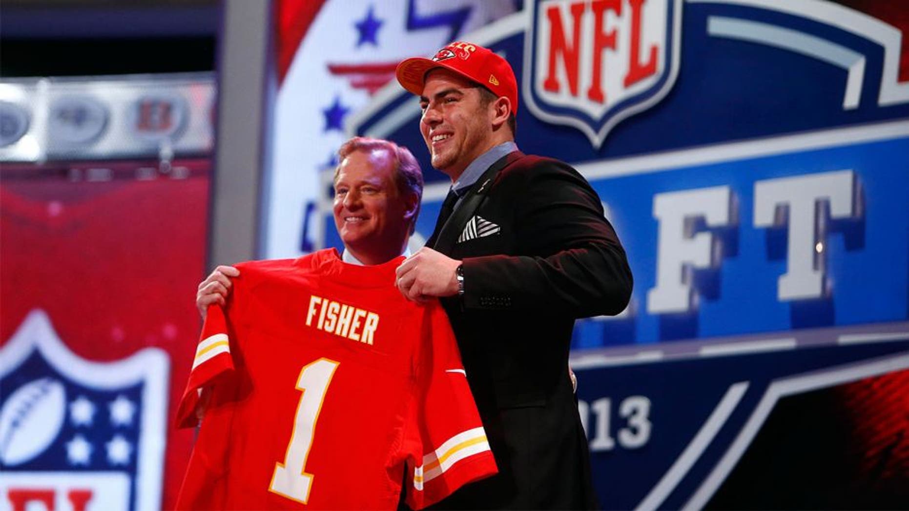 Apr 25, 2013; New York, NY, USA; NFL commissioner Roger Goodell (left) introduces Eric Fisher (Central Michigan) as the number one overall pick to the Kansas City Chiefs during the 2013 NFL Draft at Radio City Music Hall. Mandatory Credit: Jerry Lai-USA TODAY Sports