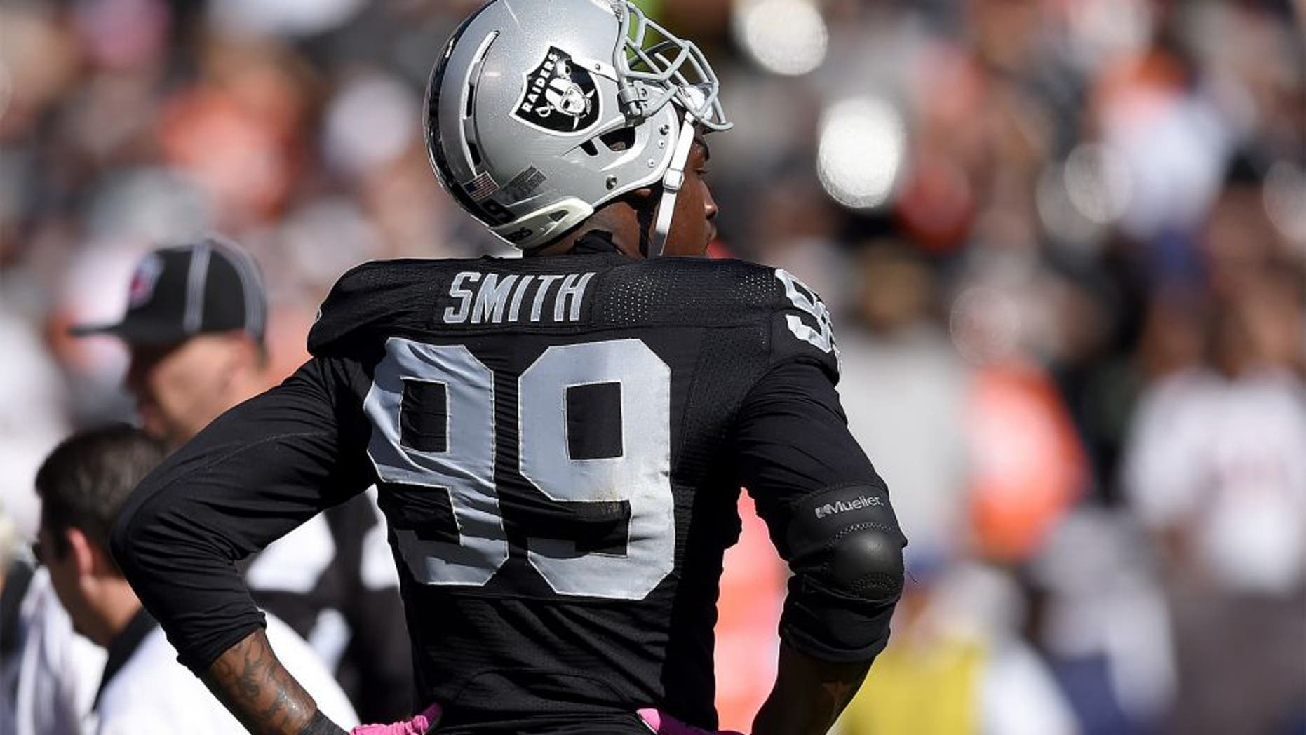 OAKLAND, CA - OCTOBER 11: Aldon Smith #99 of the Oakland Raiders looks on against the Denver Broncos at the O.co Coliseum on October 11, 2015 in Oakland, California. (Photo by Thearon W. Henderson/Getty Images)