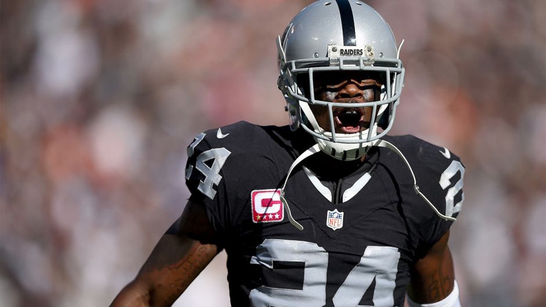 OAKLAND, CA - OCTOBER 11: Charles Woodson #24 of the Oakland Raiders celebrates after an interception against the Denver Broncos during the third quarter at the O.co Coliseum on October 11, 2015 in Oakland, California. (Photo by Thearon W. Henderson/Getty Images)
