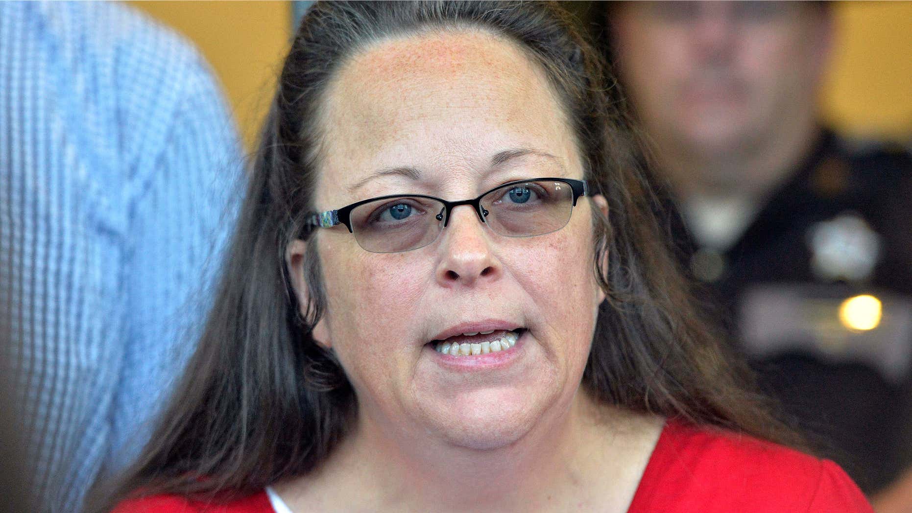 FILE - In this Sept. 14, 2015 file photo, Rowan County Clerk Kim Davis makes a statement to the media at the front door of the Rowan County Judicial Center in Morehead, Ky.
