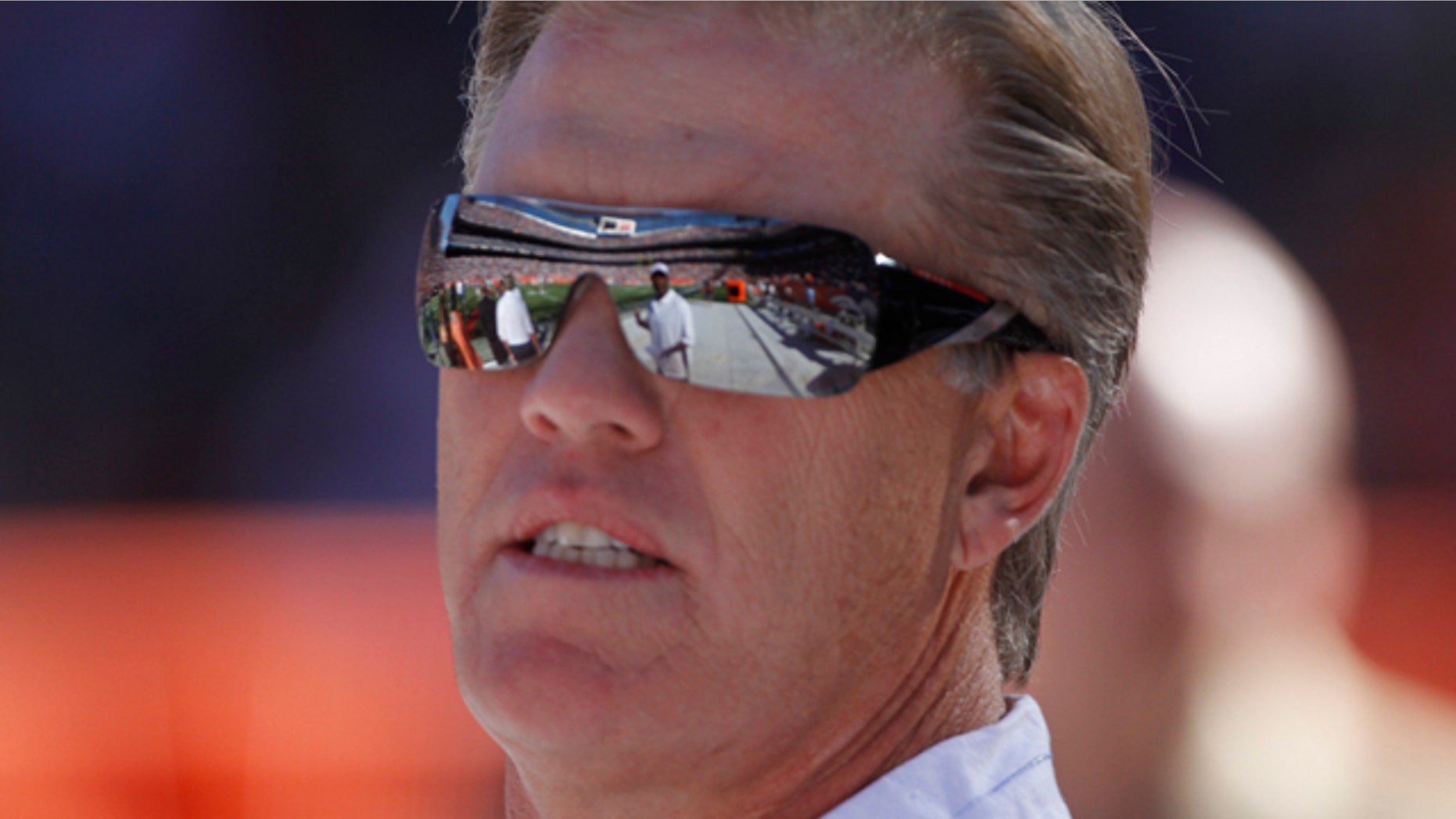 Sept. 26: Former Denver Broncos quarterback John Elway is shown during ceremonies honoring Floyd Little at halftime of a Denver Broncos game against the Indianapolis Colts, in Denver.