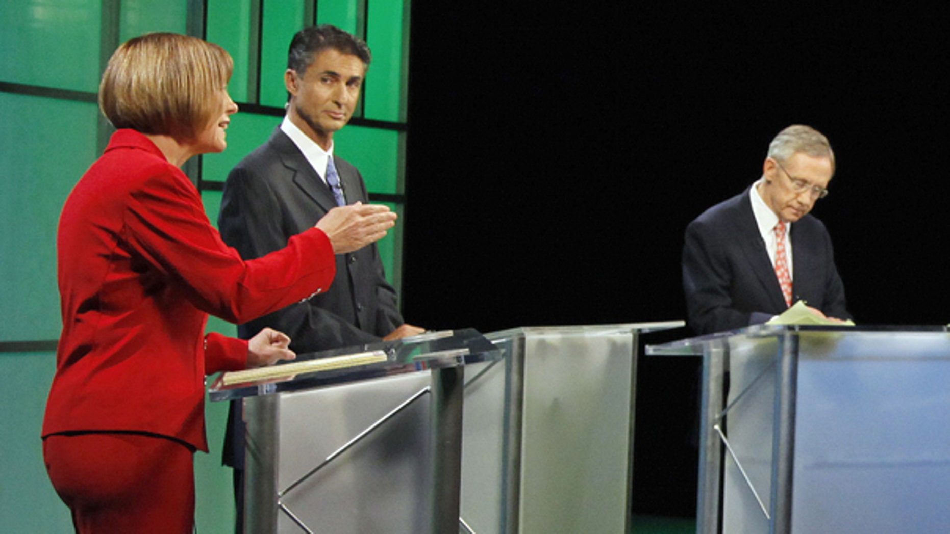 Oct. 14: Republican Senate candidate Sharron Angle, left debates Senate Majority Leader Harry Reid in Las Vegas.
