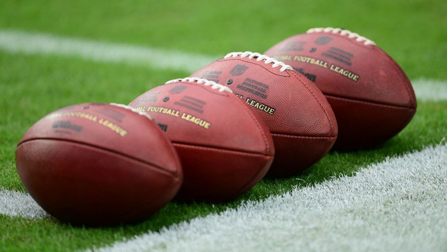 Sep 27, 2015; Glendale, AZ, USA; Footballs lie on the field prior to the game between the Arizona Cardinals and the San Francisco 49ers at University of Phoenix Stadium. Mandatory Credit: Joe Camporeale-USA TODAY Sports