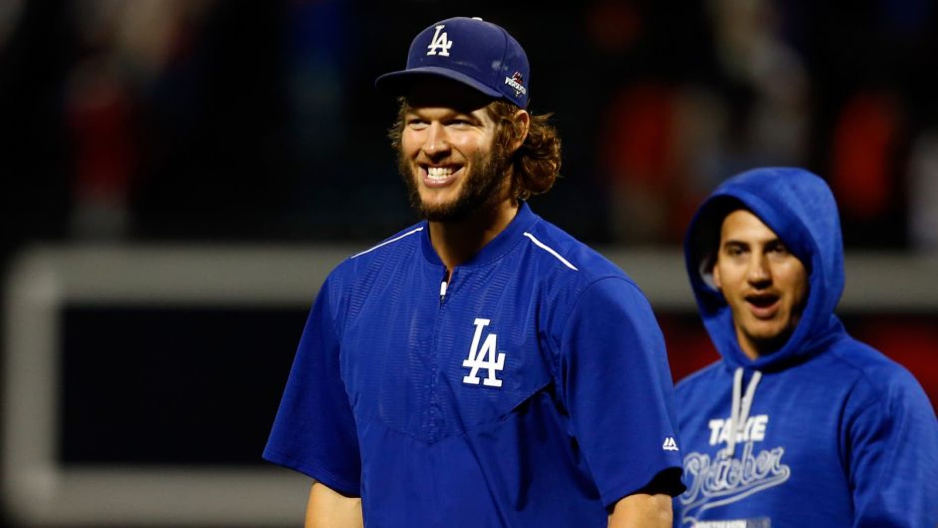 NEW YORK, NY - OCTOBER 13: Clayton Kershaw #22 of the Los Angeles Dodgers smiles after defeating the New York Mets in game four of the National League Division Series at Citi Field on October 13, 2015 in New York City. The Dodgers defeated the Mets with a score of 3 to 1. (Photo by Mike Stobe/Getty Images)