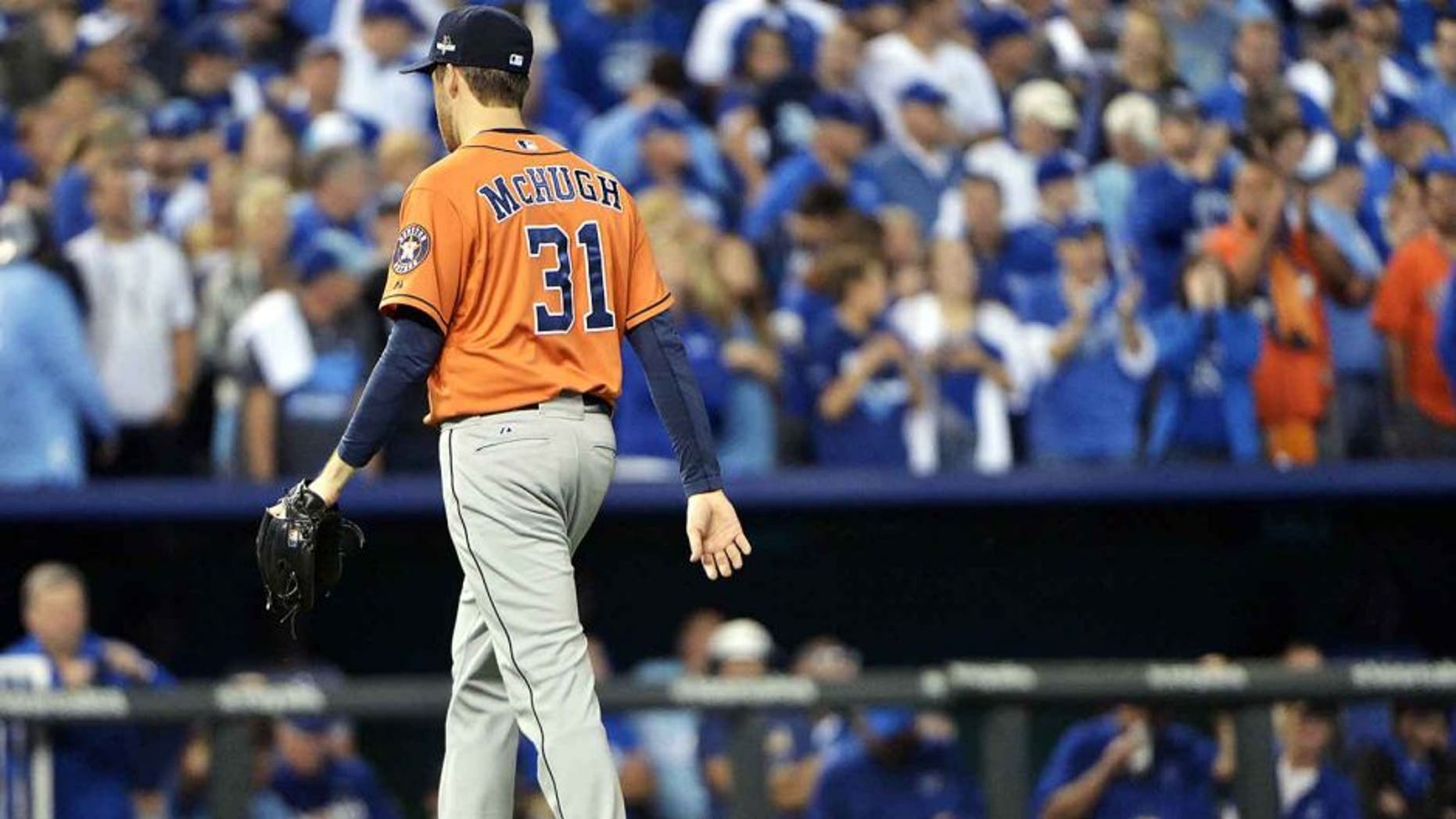 Oct 14, 2015; Kansas City, MO, USA; Houston Astros starting pitcher Collin McHugh (31) walks to the dugout after being relived against the Kansas City Royals in the fifth inning in game five of the ALDS at Kauffman Stadium. Mandatory Credit: Denny Medley-USA TODAY Sports