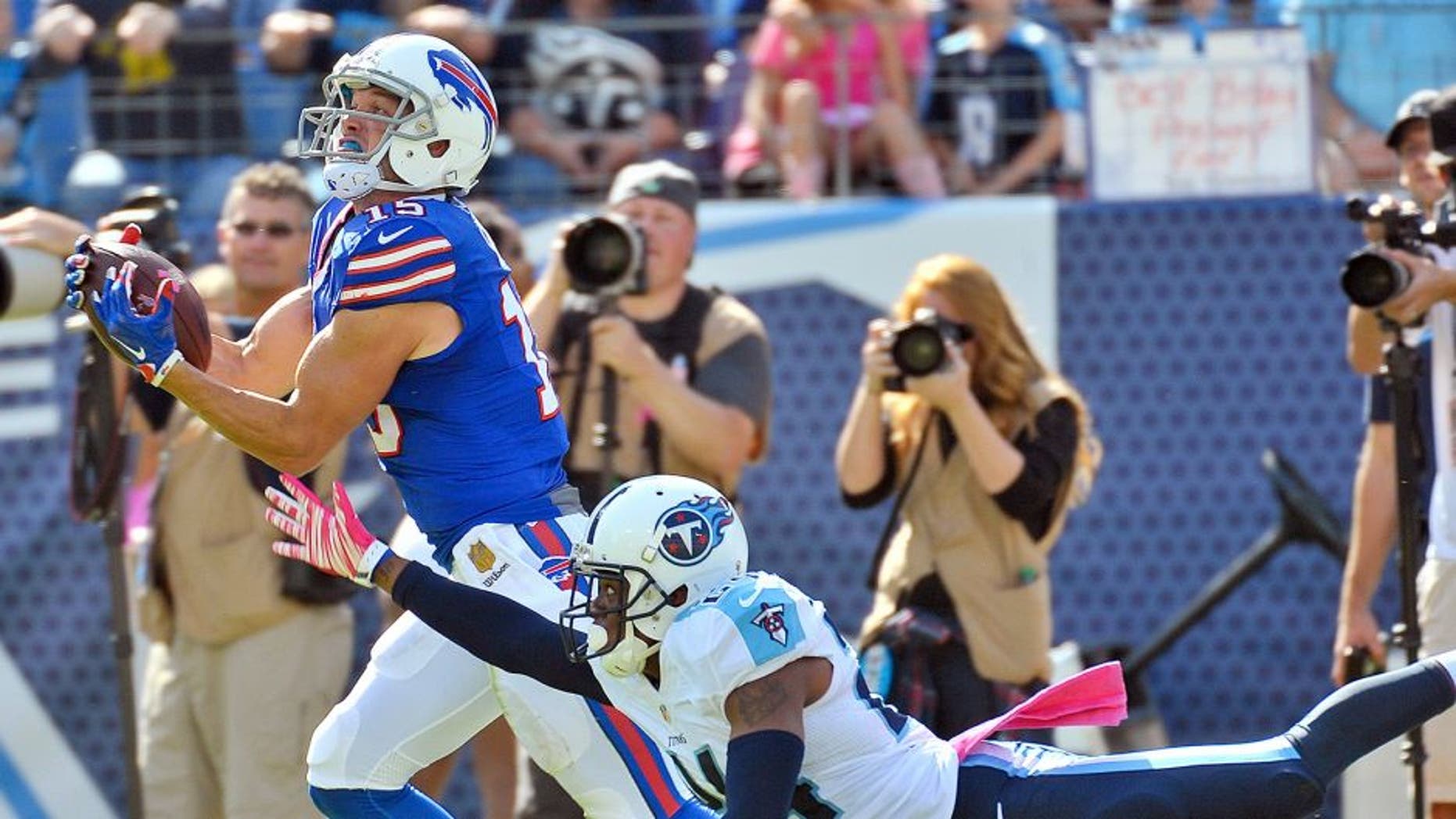 Oct 11, 2015; Nashville, TN, USA; Buffalo Bills wide receiver Chris Hogan (15) catches a pass against Tennessee Titans cornerback Coty Sensabaugh (24) to set up for the touchdown during the second half at Nissan Stadium. Buffalo won 14-13. Mandatory Credit: Jim Brown-USA TODAY Sports