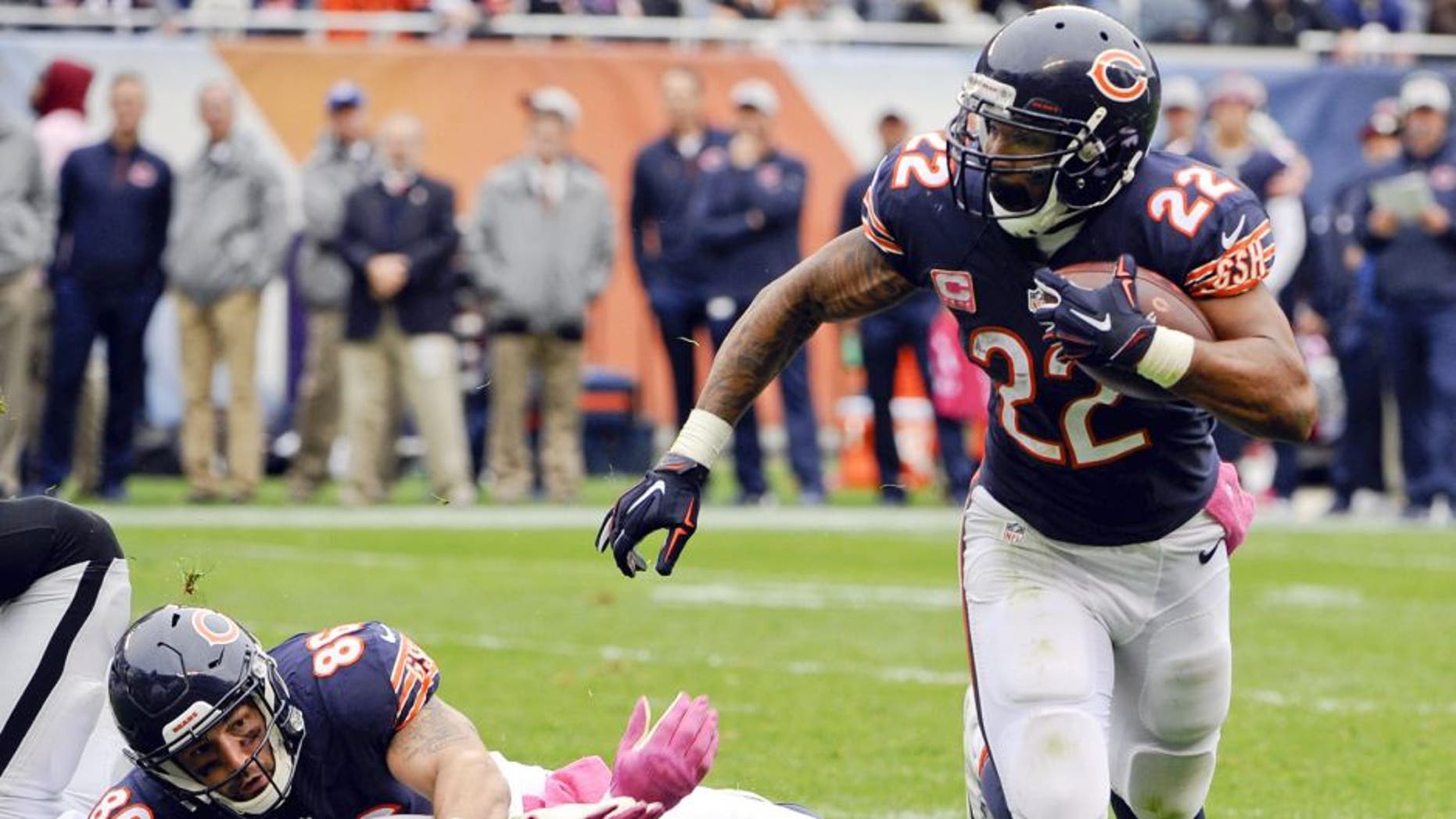 Oct 4, 2015; Chicago, IL, USA; Chicago Bears running back Matt Forte (22) breaks free from Oakland Raiders outside linebacker Aldon Smith (99) as Chicago Bears tight end Zach Miller (86) blocks during their game at Soldier Field. Mandatory Credit: Matt Marton-USA TODAY Sports