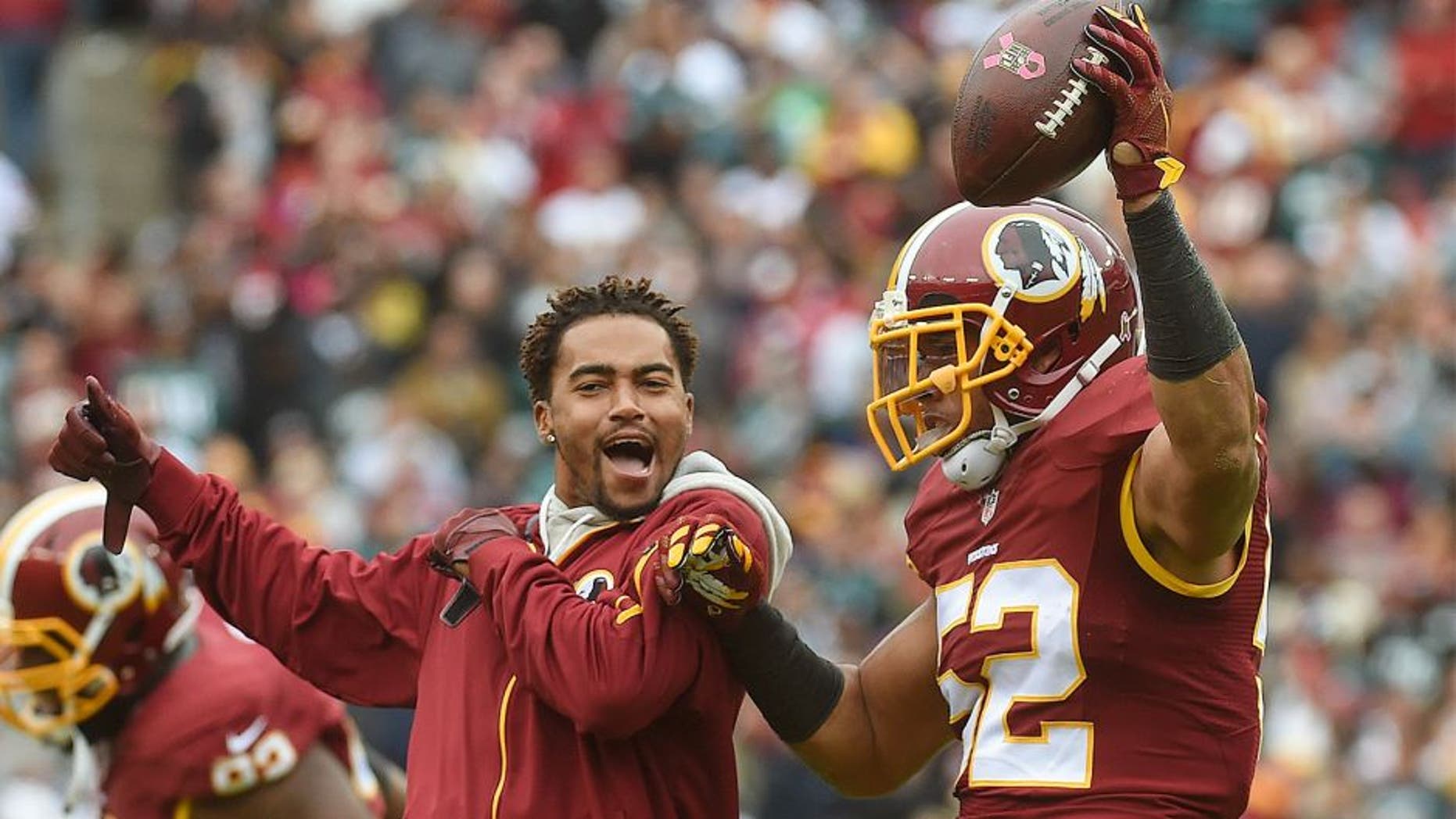 LANDOVER, MD- OCTOBER 4: CAPTION CORRECTION Washington Redskins wide receiver DeSean Jackson (11), left, joins Washington Redskins inside linebacker Keenan Robinson (52) as he celebrates his second-quarter fumble recovery in the game between the Washington Redskins and the Philadelphia Eagles at FedEx Field on Sunday, October 4, 2015. (Photo by Toni L. Sandys/ The Washington Post via Getty Images)
