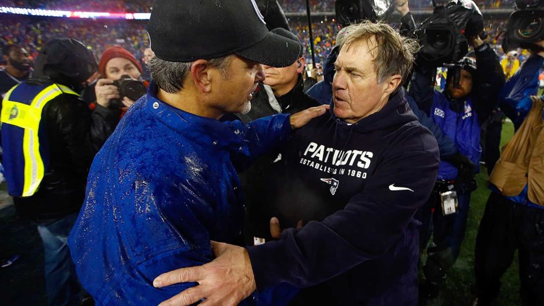 FOXBORO, MA - JANUARY 18: Head coach Chuck Pagano of the Indianapolis Colts and head coach Bill Belichick of the New England Patriots shake hands after the 2015 AFC Championship Game at Gillette Stadium on January 18, 2015 in Foxboro, Massachusetts. The Patriots defeated the Colts 45-7. (Photo by Jared Wickerham/Getty Images)