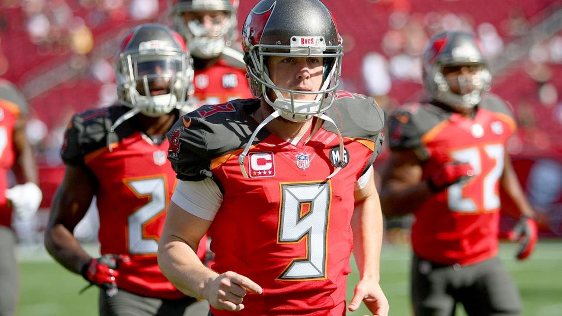 TAMPA, FL - DECEMBER 28: Michael Koenen #9 of the Tampa Bay Buccaneers is seen as he runs onto the field during an NFL football game against the New Orleans Saints at Raymond James Stadium on December 28, 2014 in Tampa, Florida. (Photo by Alex Menendez/Getty Images)
