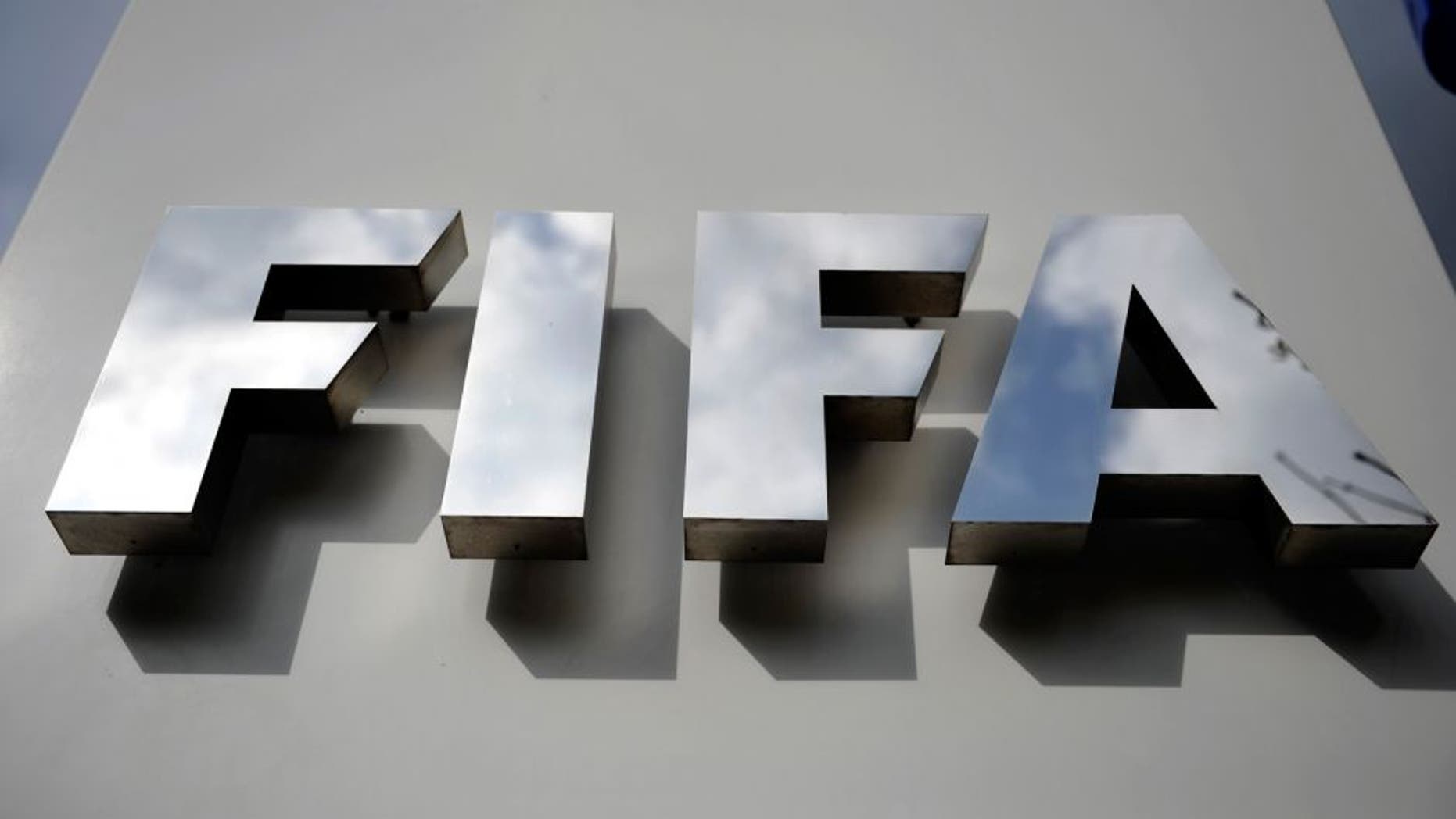 ZURICH, SWITZERLAND - OCTOBER 09: A FIFA logo next to the entrance at the FIFA headquarters on October 9, 2015 in Zurich, Switzerland. On Thursday, FIFA's Ethics Committee provisionally banned FIFA President Joseph S. Blatter from all football activities for the duration of 90 days. (Photo by Harold Cunningham/Getty Images)