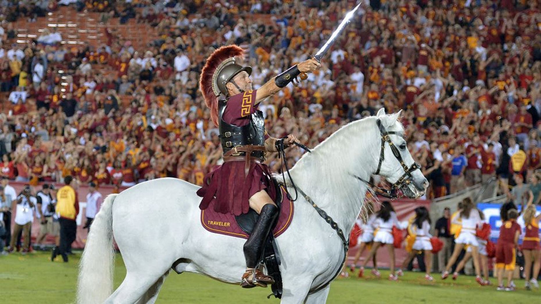 Sep 5, 2015; Los Angeles, CA, USA; Southern California Trojans white horse mascot Traveler with rider Hector Aguilar during the game against the Arkansas State Red Wolves at Los Angeles Memorial Coliseum. Mandatory Credit: Kirby Lee-USA TODAY Sports