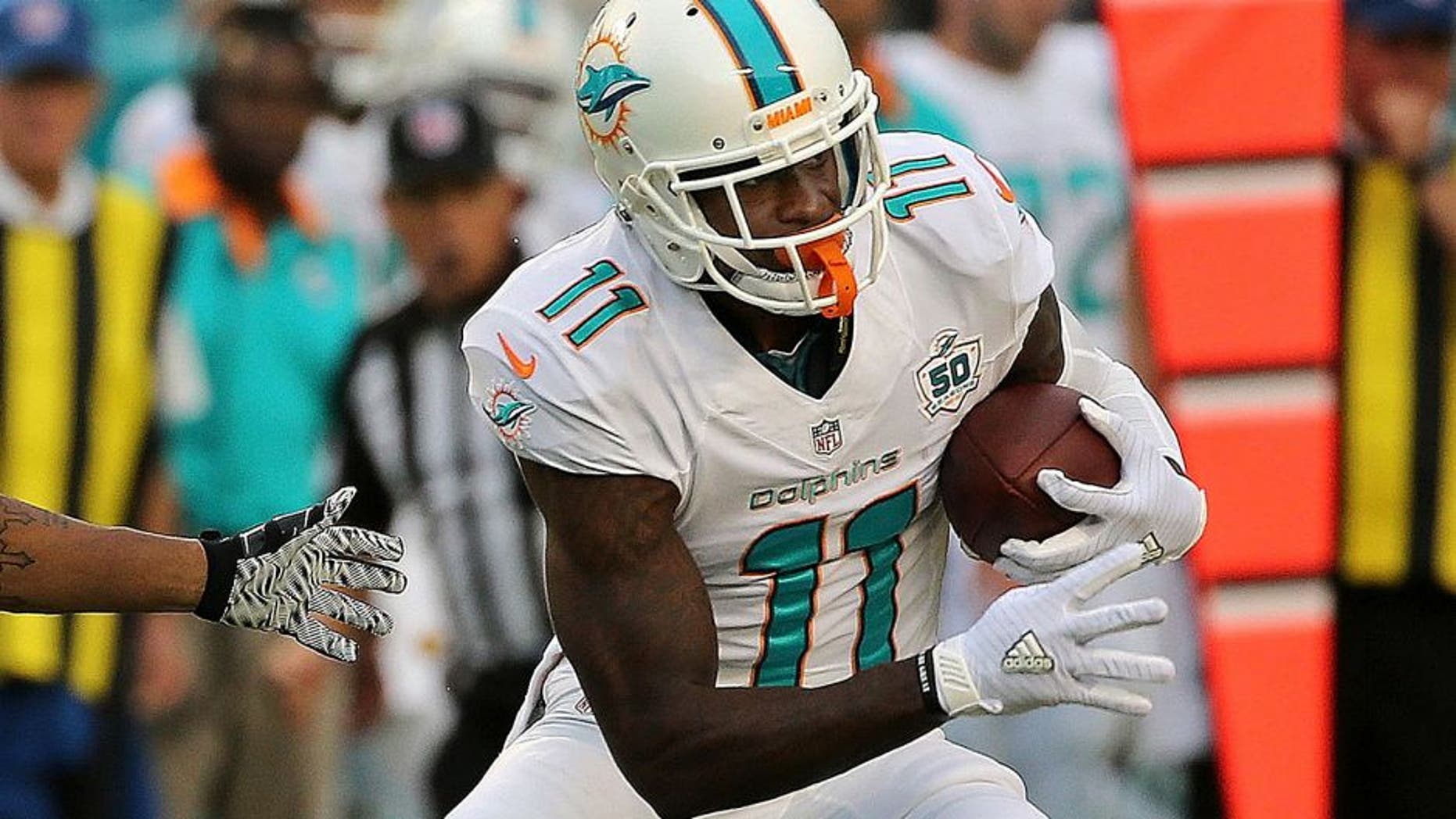MIAMI GARDENS, FL - SEPTEMBER 27: DeVante Parker #11 of the Miami Dolphins is defended by Anthony Dixon #26 of the Buffalo Bills during a game at Sun Life Stadium on September 27, 2015 in Miami Gardens, Florida. (Photo by Mike Ehrmann/Getty Images)