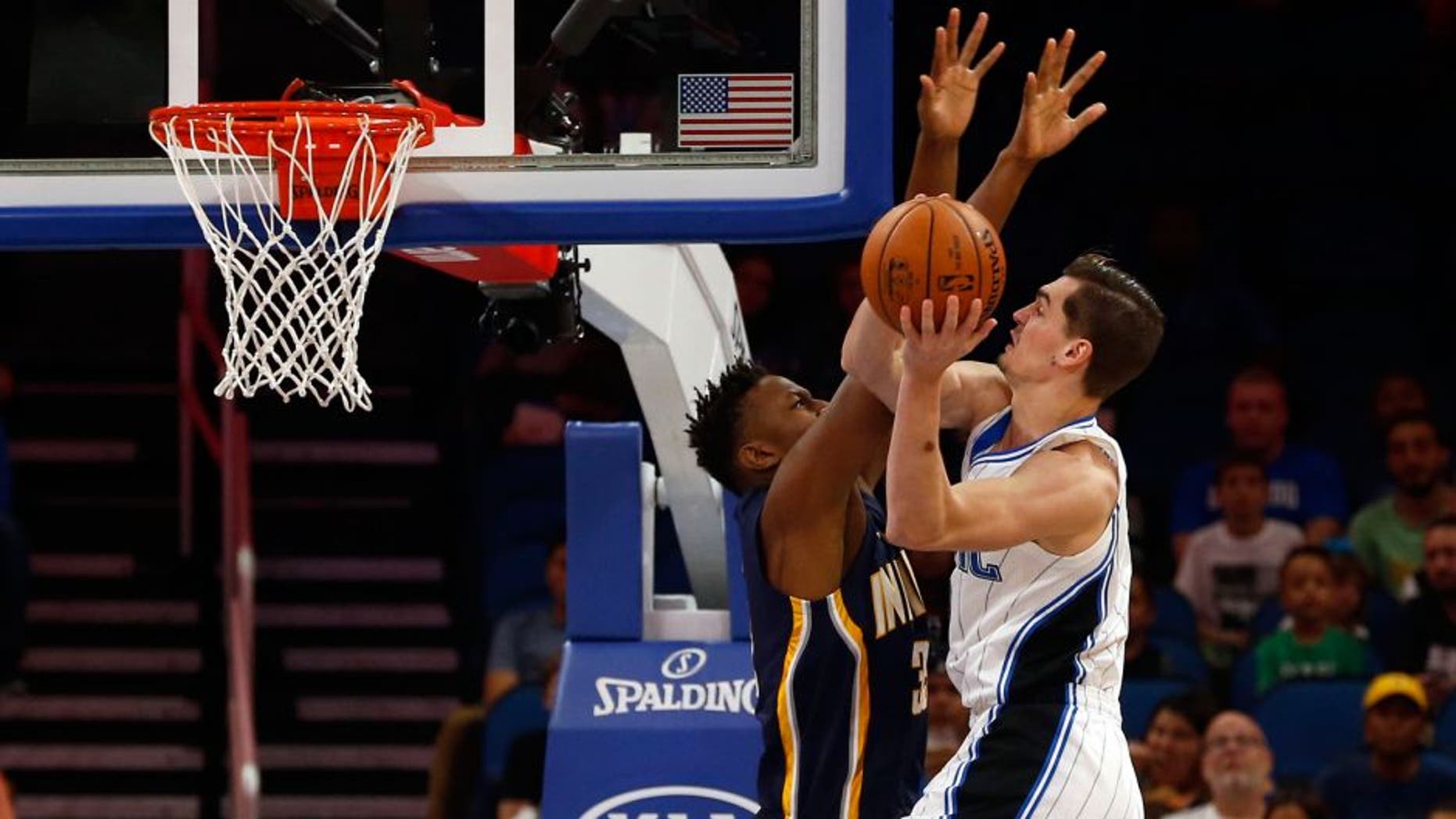 Oct 14, 2016; Orlando, FL, USA; Orlando Magic guard Mario Hezonja (8) shoots around Indiana Pacers forward Myles Turner (33) during the first quarter at Amway Center. Mandatory Credit: Kim Klement-USA TODAY Sports