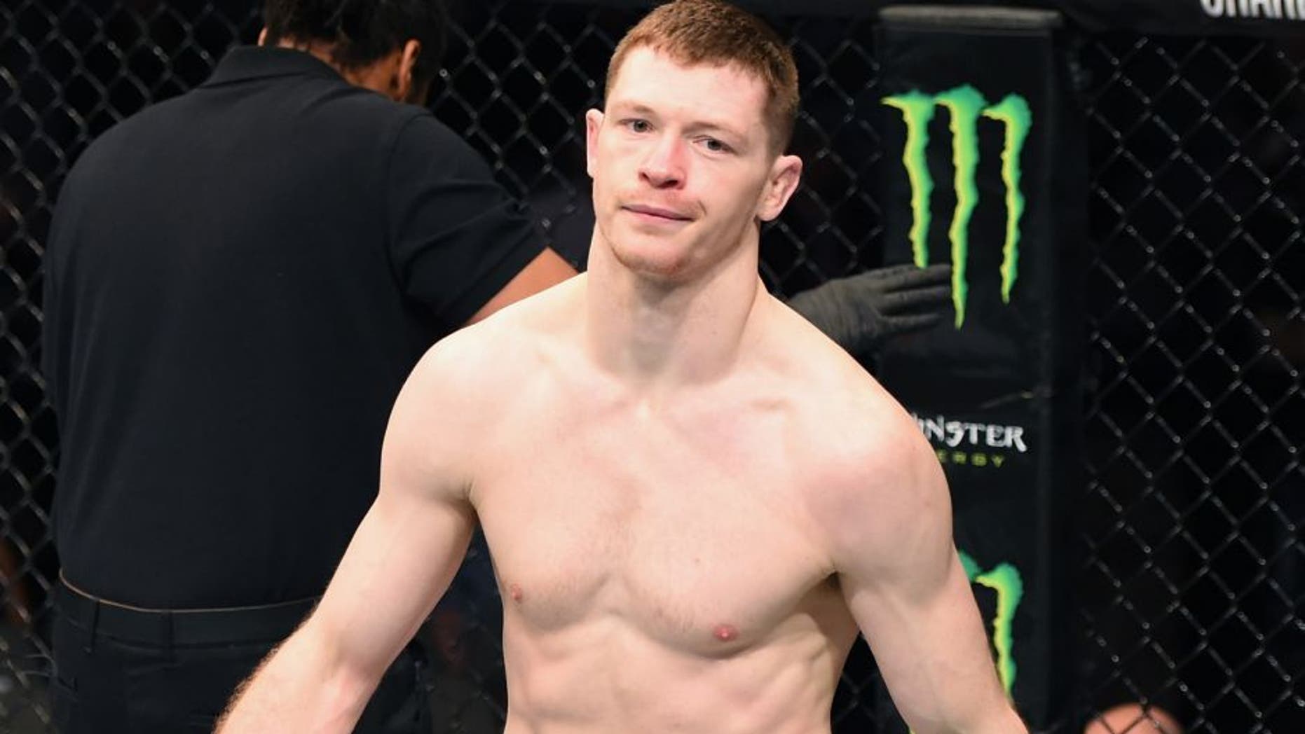 DALLAS, TX - MARCH 14: (L-R) Joseph Duffy walks back to this corner after defeating Jake Lindsey in their lightweight bout during the UFC 185 event at the American Airlines Center on March 14, 2015 in Dallas, Texas. (Photo by Josh Hedges/Zuffa LLC/Zuffa LLC via Getty Images)