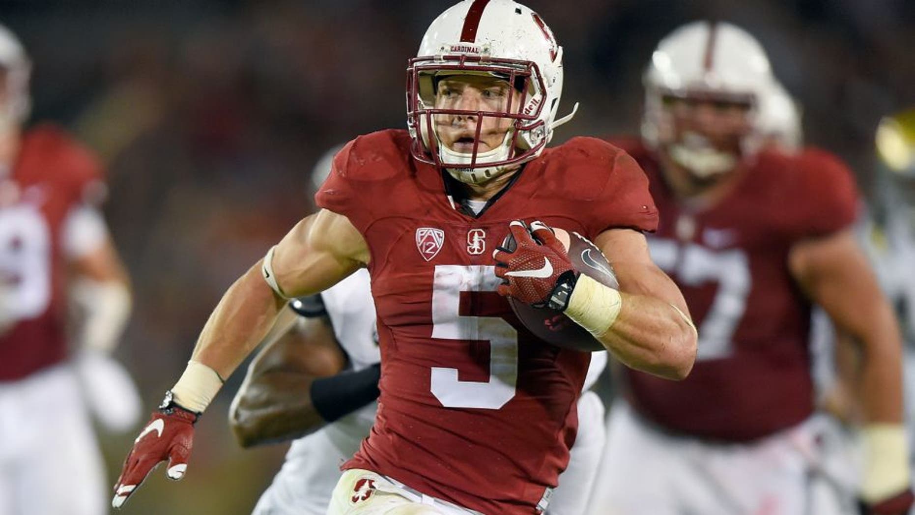 PALO ALTO, CA - OCTOBER 15: Christian McCaffrey #5 of the Stanford Cardinal's rushes for a twenty eight yard touchdown run against the UCLA Bruins in the second quarter of an NCAA football game at Stanford Stadium on October 15, 2015 in Stanford, California. (Photo by Thearon W. Henderson/Getty Images)