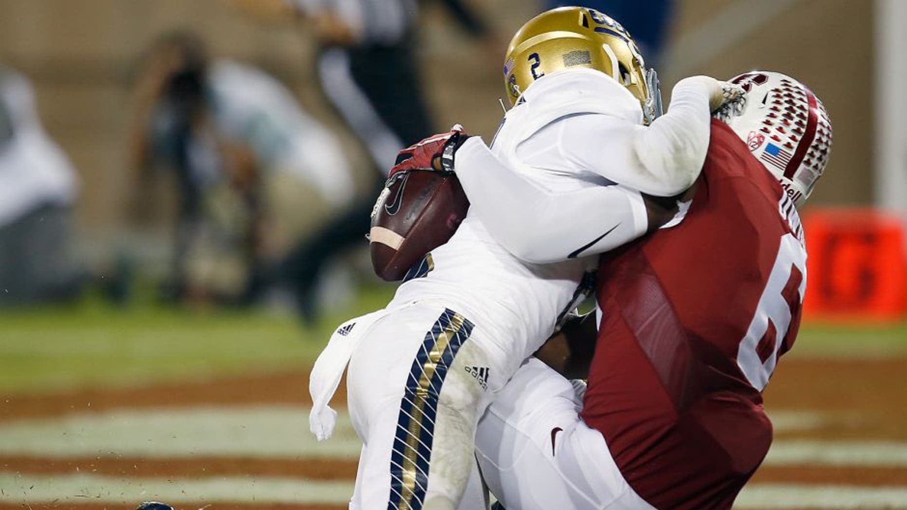 Stanford wide receiver Francis Owusu, right, catches a touchdown pass behind the back of UCLA defensive back Jaleel Wadood during the second half of an NCAA college football game Thursday, Oct. 15, 2015, Stanford, Calif. (AP Photo/Tony Avelar)