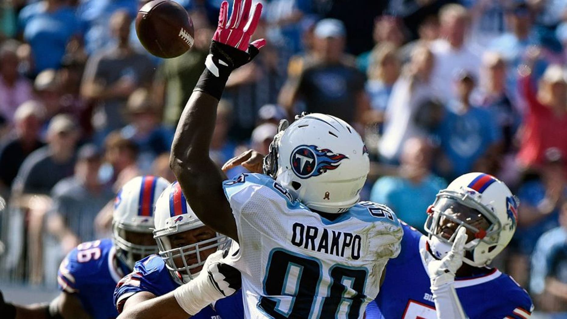NASHVILLE, TN - OCTOBER 11: Quarterback Tyrod Taylor #5 of the Buffalo Bills passes the ball over Brian Orakpo #98 of the Tennessee Titans during the second half of a game at Nissan Stadium on October 11, 2015 in Nashville, Tennessee. (Photo by Frederick Breedon/Getty Images)