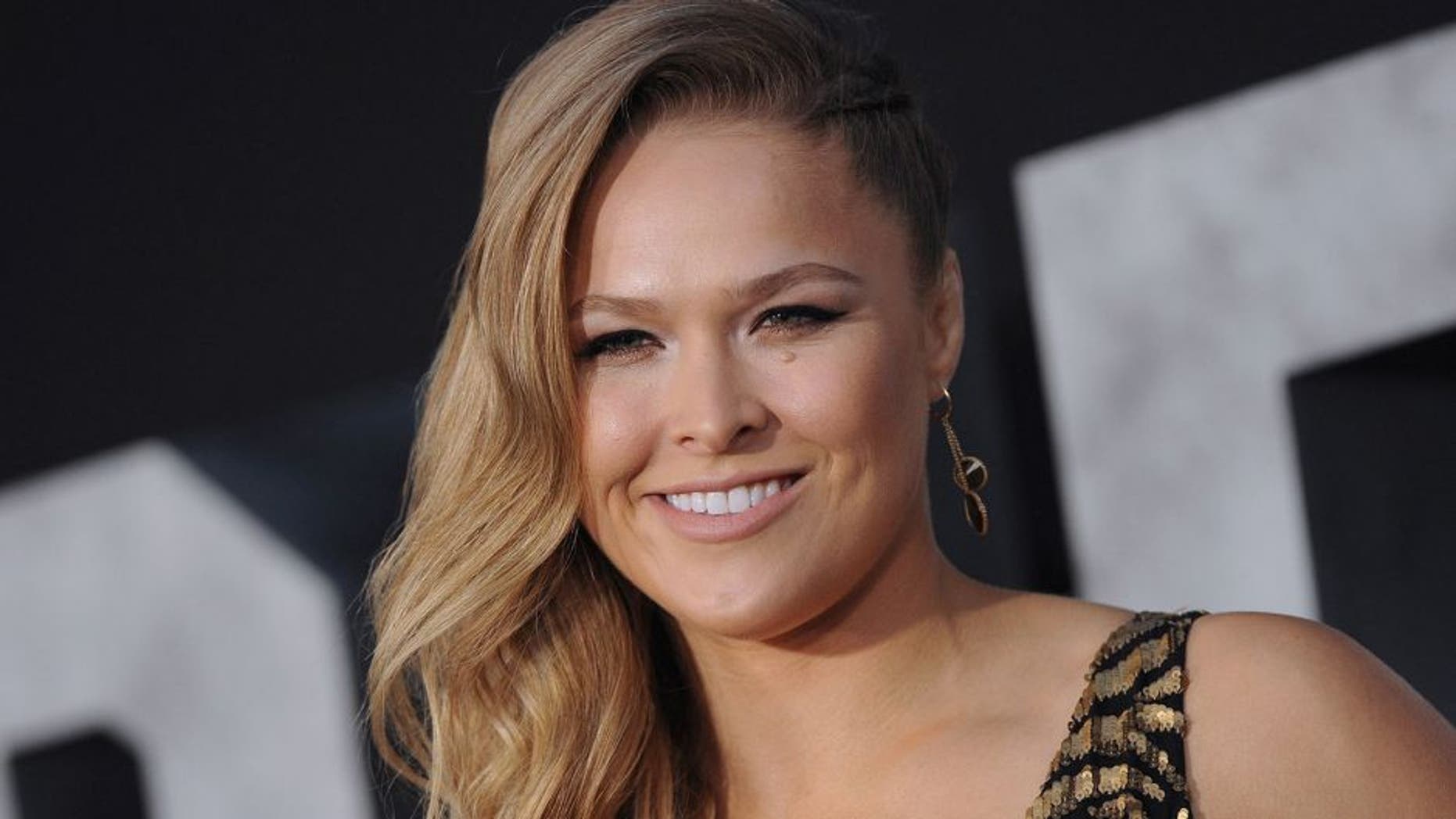 HOLLYWOOD, CA - AUGUST 11: Actress/MMA fighter Ronda Rousey arrives at the Los Angeles premiere of 'The Expendables 3' at TCL Chinese Theatre on August 11, 2014 in Hollywood, California. (Photo by Axelle/Bauer-Griffin/FilmMagic)