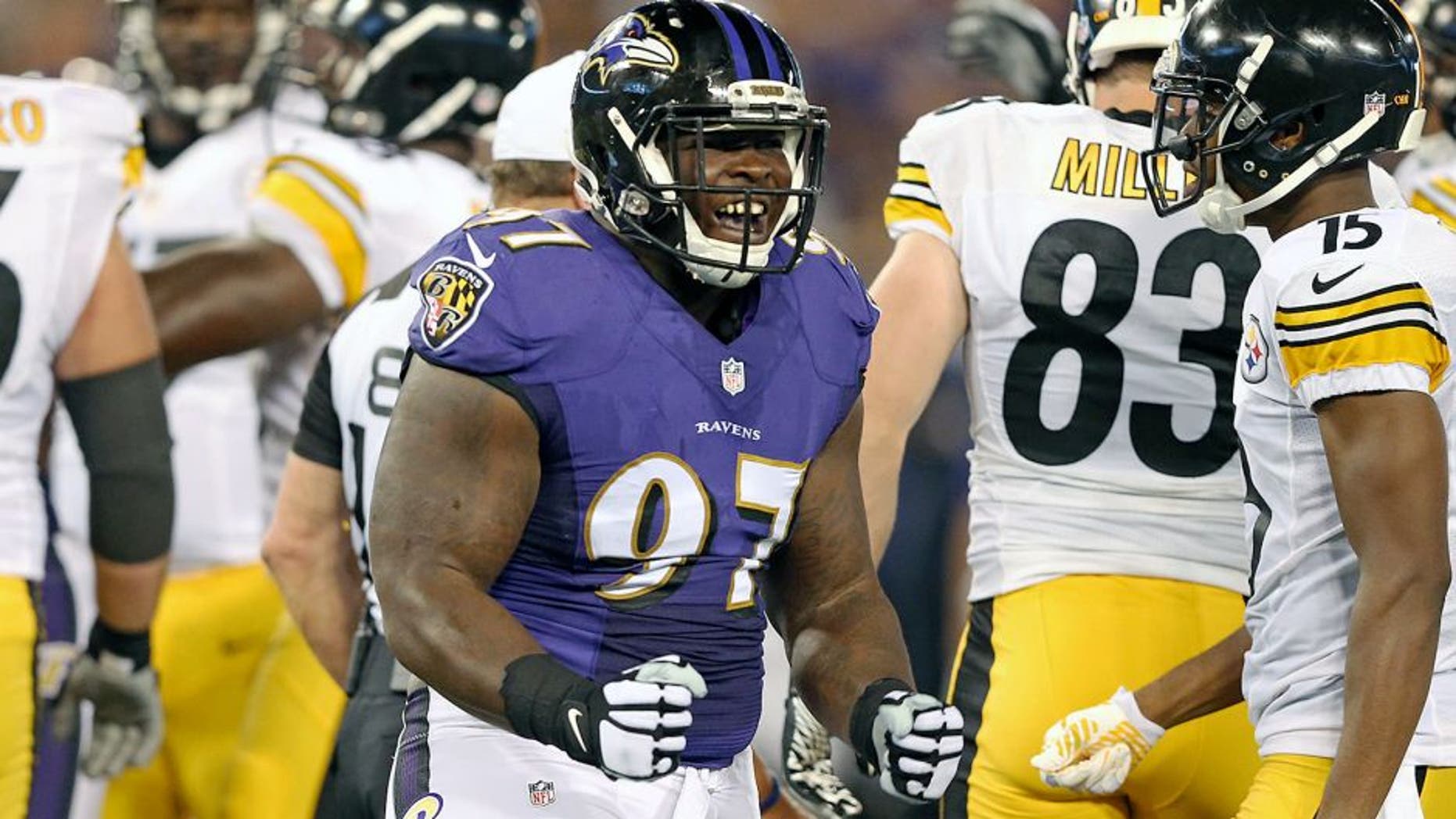 Sep 11, 2014; Baltimore, MD, USA; Baltimore Ravens tackle Timmy Jernigan (97) reacts following his tackle against the Pittsburgh Steelers at M&T Bank Stadium. Mandatory Credit: Mitch Stringer-USA TODAY Sports