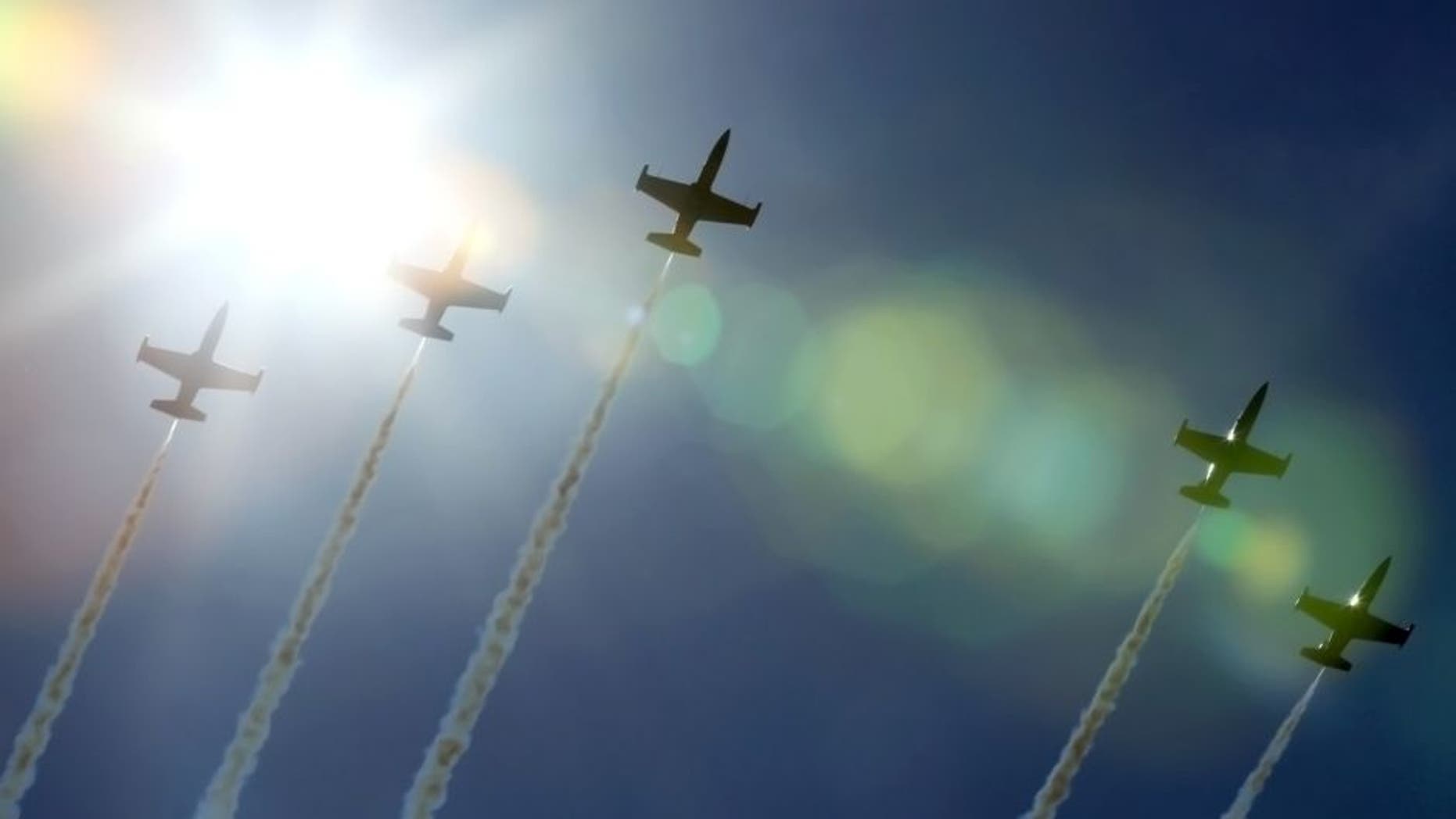 Jets from the Breitling Jet Team, made up of seven L-39C Albatros aircraft, fly over Gary, Ind., on Thursday, Aug. 13, 2015, amid practice for the Chicago Air and Water Show. (Antonio Perez/Chicago Tribune/TNS via Getty Images)