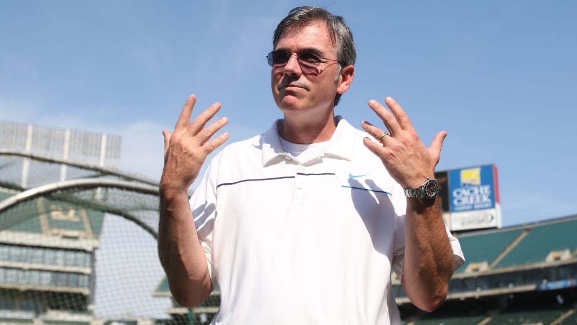 OAKLAND, CA - JULY 3: General Manager Billy Beane of the Oakland Athletics stands on the field prior to the game against the Chicago Cubs at O.co Coliseum on July 3, 2013 in Oakland, California. The Cubs defeated the Athletics 3-1. (Photo by Michael Zagaris/Oakland Athletics/Getty Images) *** Local Caption *** Billy Beane