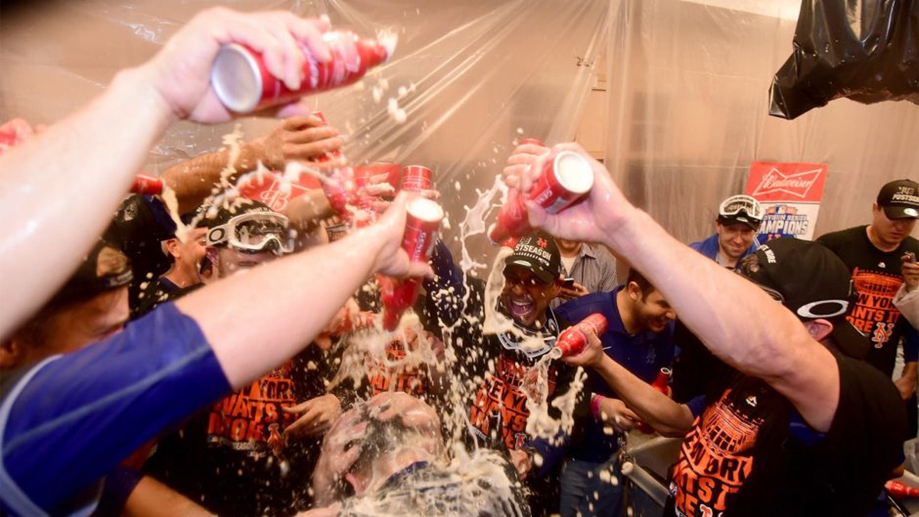 LOS ANGELES, CA - OCTOBER 15: The New York Mets celebrate in the locker room after the Mets 3-2 victory against the Los Angeles Dodgers in game five of the National League Division Series at Dodger Stadium on October 15, 2015 in Los Angeles, California. (Photo by Harry How/Getty Images)