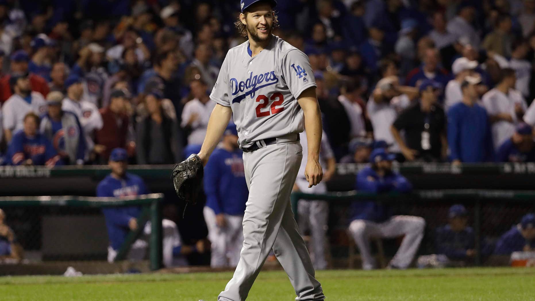 Los Angeles Dodgers starting pitcher Clayton Kershaw (22) reacts as he walks off the mound after the seventh inning of Game 2 of the National League baseball championship series against the Chicago Cubs, Sunday, Oct. 16, 2016, in Chicago.