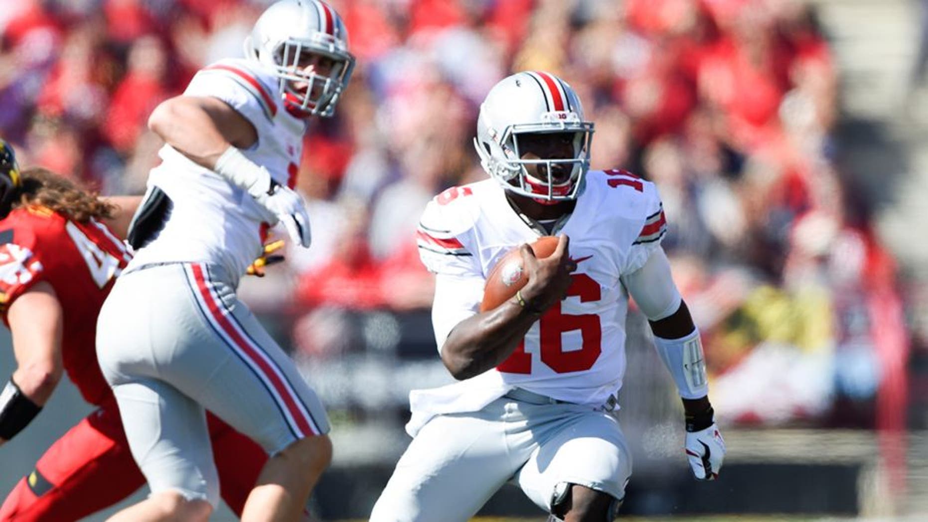 Oct 4, 2014; College Park, MD, USA; Ohio State Buckeyes quarterback J.T. Barrett (16) runs with the ball during the second quarter against the Maryland Terrapins at Byrd Stadium. Mandatory Credit: Tommy Gilligan-USA TODAY Sports