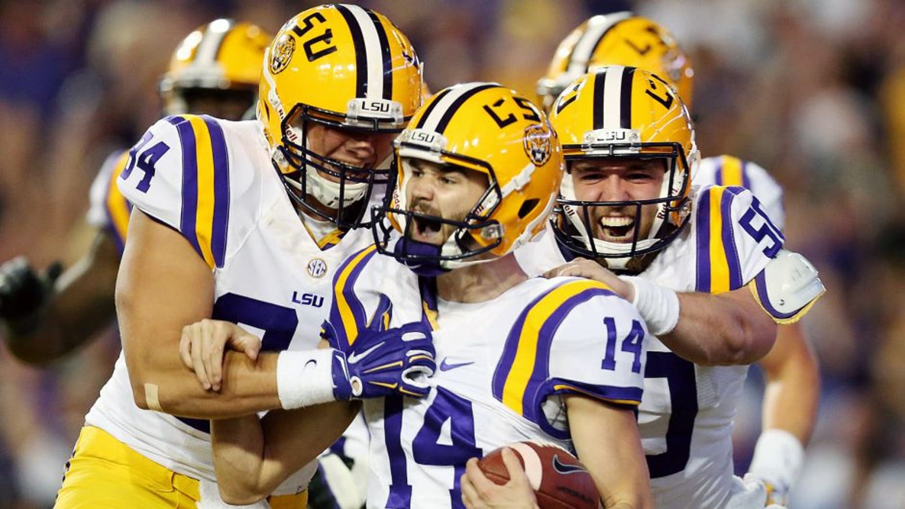 BATON ROUGE, LA - OCTOBER 17: Trent Domingue #14 of the LSU Tigers celebrates after scoring a touchdown on a fake field goal against the Florida Gators at Tiger Stadium on October 17, 2015 in Baton Rouge, Louisiana. (Photo by Chris Graythen/Getty Images)