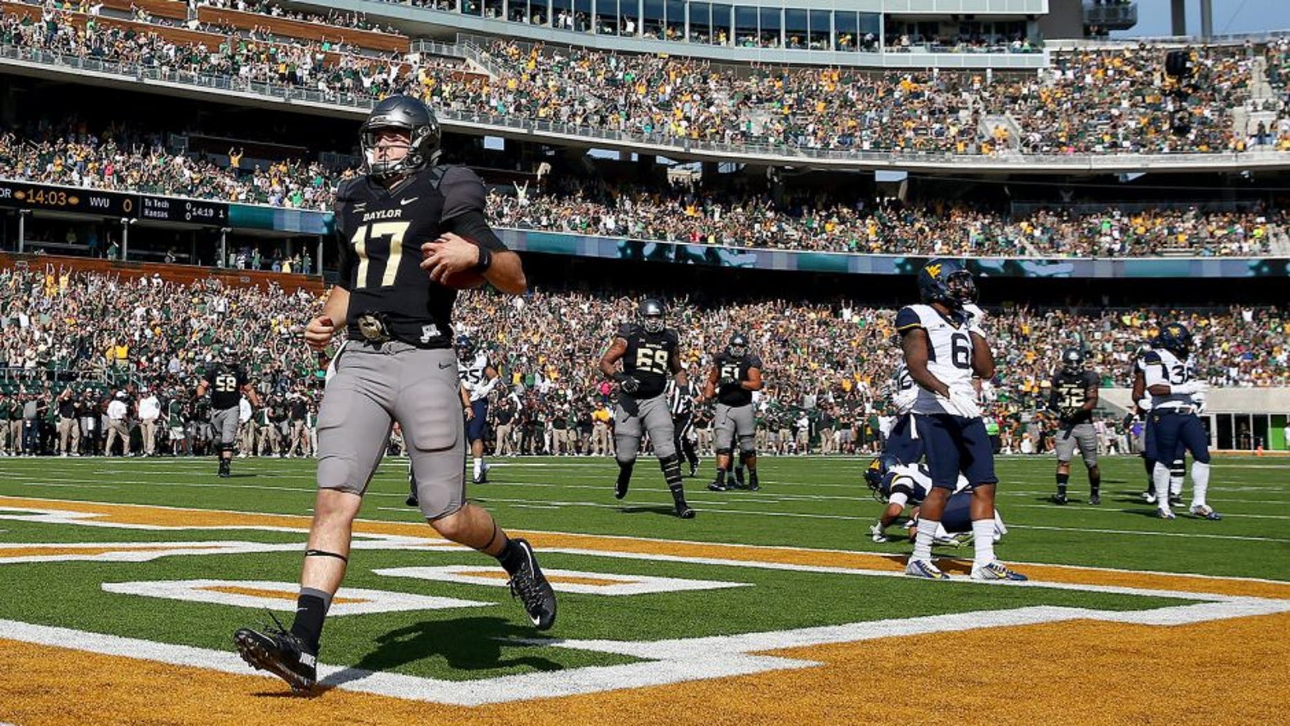WACO, TX - OCTOBER 17: Seth Russell #17 of the Baylor Bears scores a touchdown against the West Virginia Mountaineers in the second quarter at McLane Stadium on October 17, 2015 in Waco, Texas. (Photo by Tom Pennington/Getty Images)